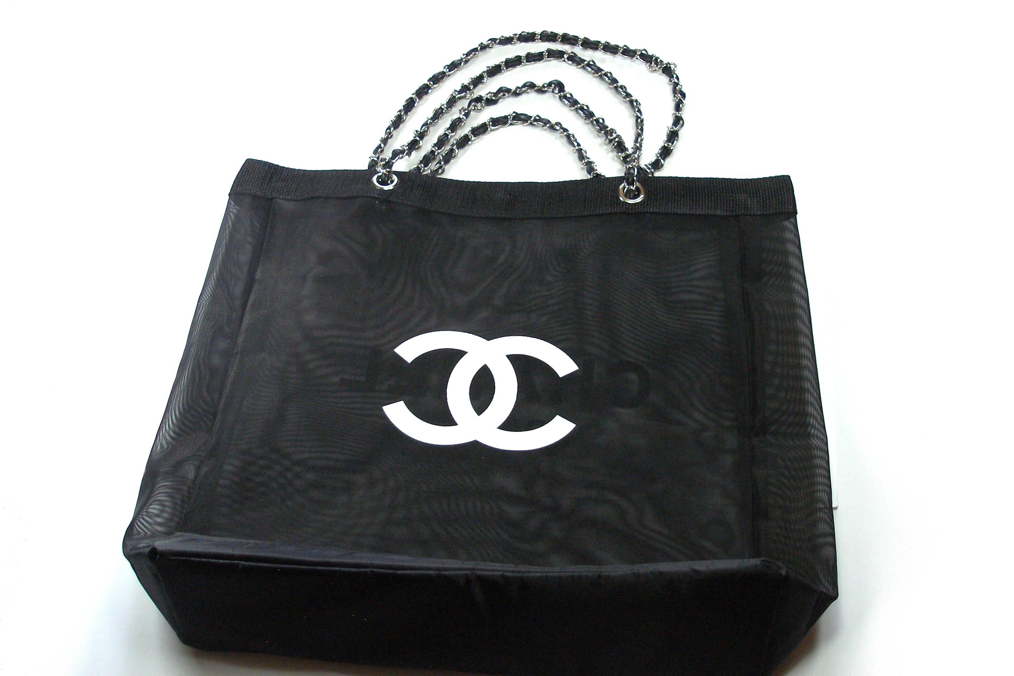 CHANEL VIP Black Mesh Tote Bag Shopping Travel Shopper Leather(Faux Leather) and silver métal chaine .
Size(approx):  36 x 36 x 11 cm 
VIP Customers Gift form beauty counter , not from retail store.
NO DUST BAG OR HOLOGRAM AS THIS IS A VIP GIFT