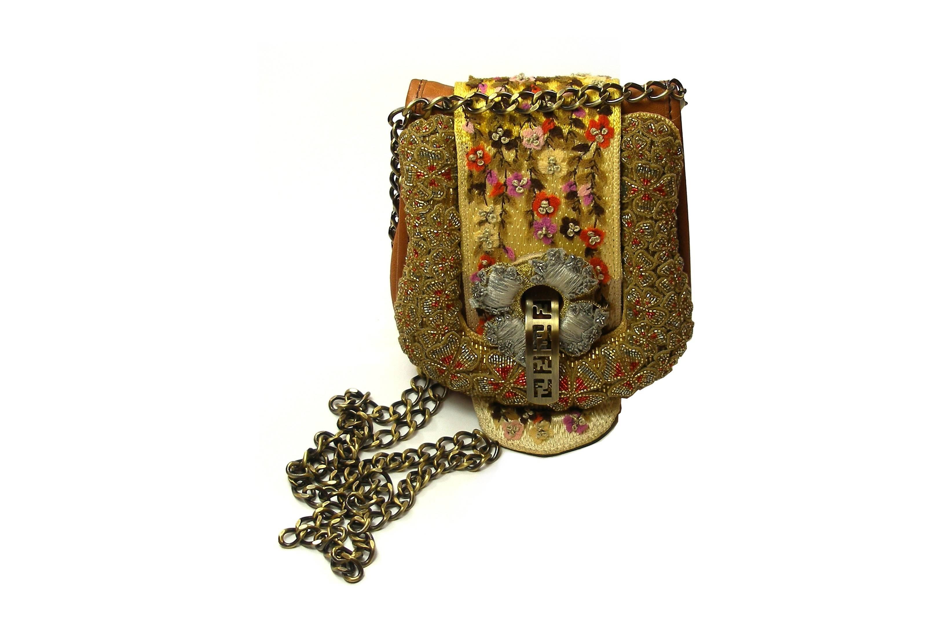 SO CUTE ! 
FENDI MA-GNI-FIC and COLLECTOR Mini Bag 
Adorned with sequins and sewn tiny flowers !
Natural leather / Métal shoulder strap
PLEASE NOTE THAT ALL BEADS ARE INTACT
 this bag was never used and is in excellente condition.
There are two
