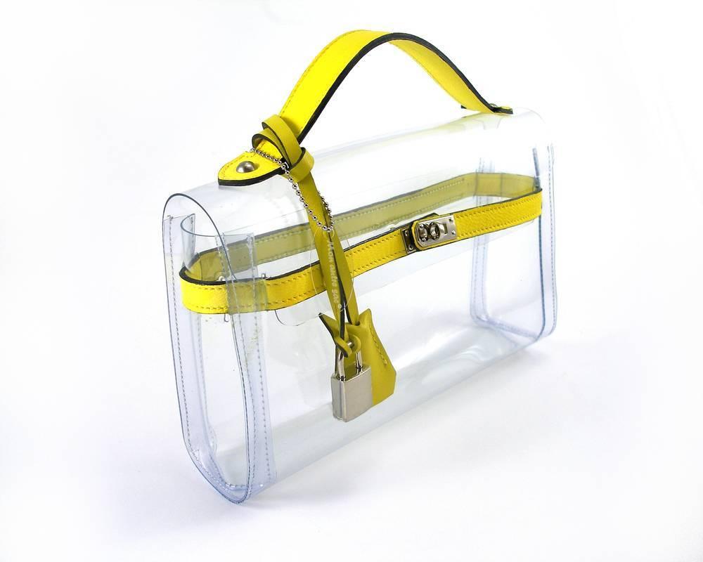 MA-GNI-FIC 
Our own production and brand filed Mon Autre Sac ® 
Highlight your luxury accessories!
Nice Pvc and Leather Bag 
Clutch Crystal 
Size :   L 25 X H 14 X P 6
Yellow leather 
Brand New
Its comes with dustbag  Mon Autre Sac ®
INTERNATIONALS