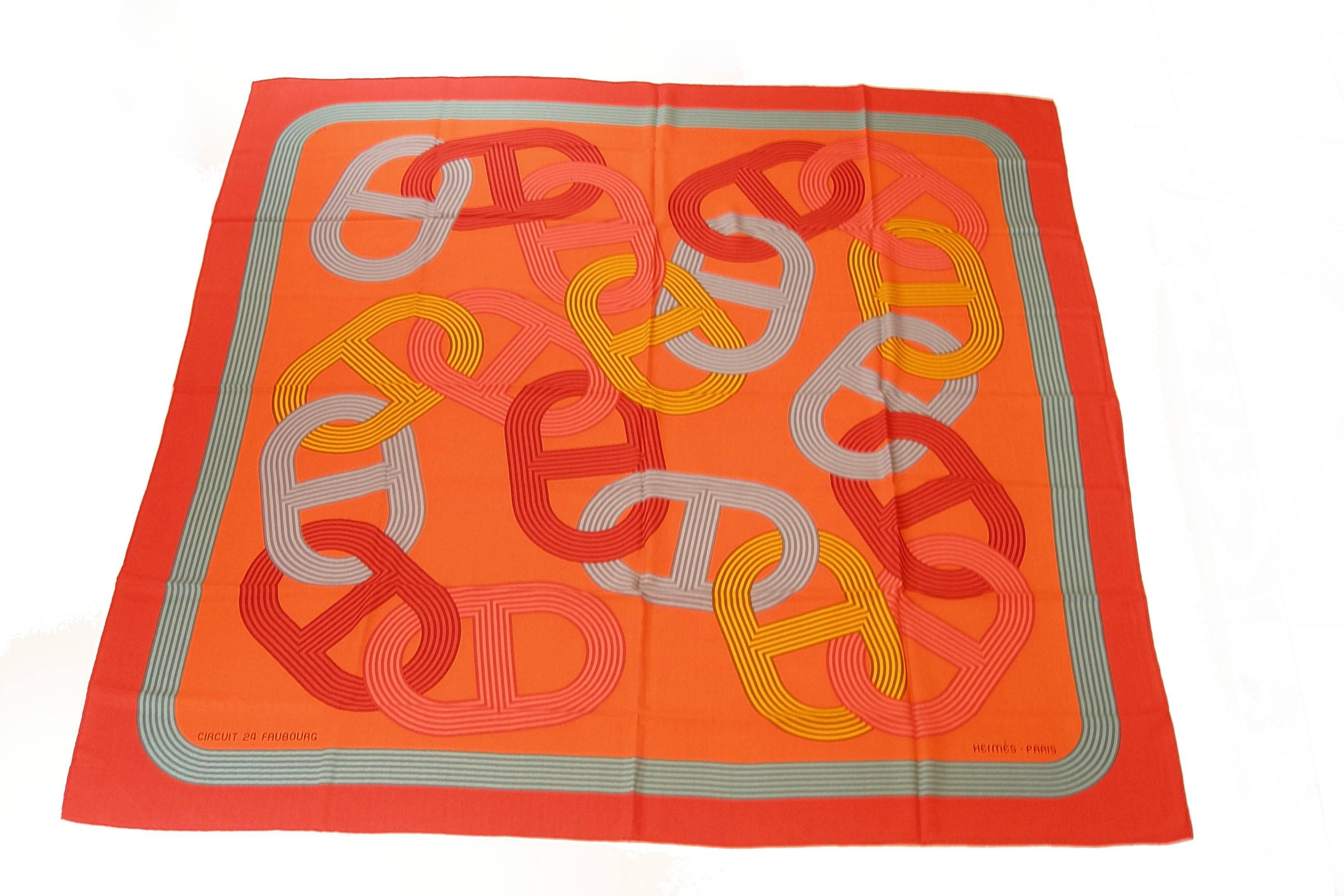     Wonderfull Colors 
    Circuit 24 Faubourg
     Main background colours are orange 
    Cashmere 65% and Silk 35%.
    It measures 140cm by 140cm.
    This shawl has never been worn.
    Sorry no box 
    Its comes with Hermès shopping bag and