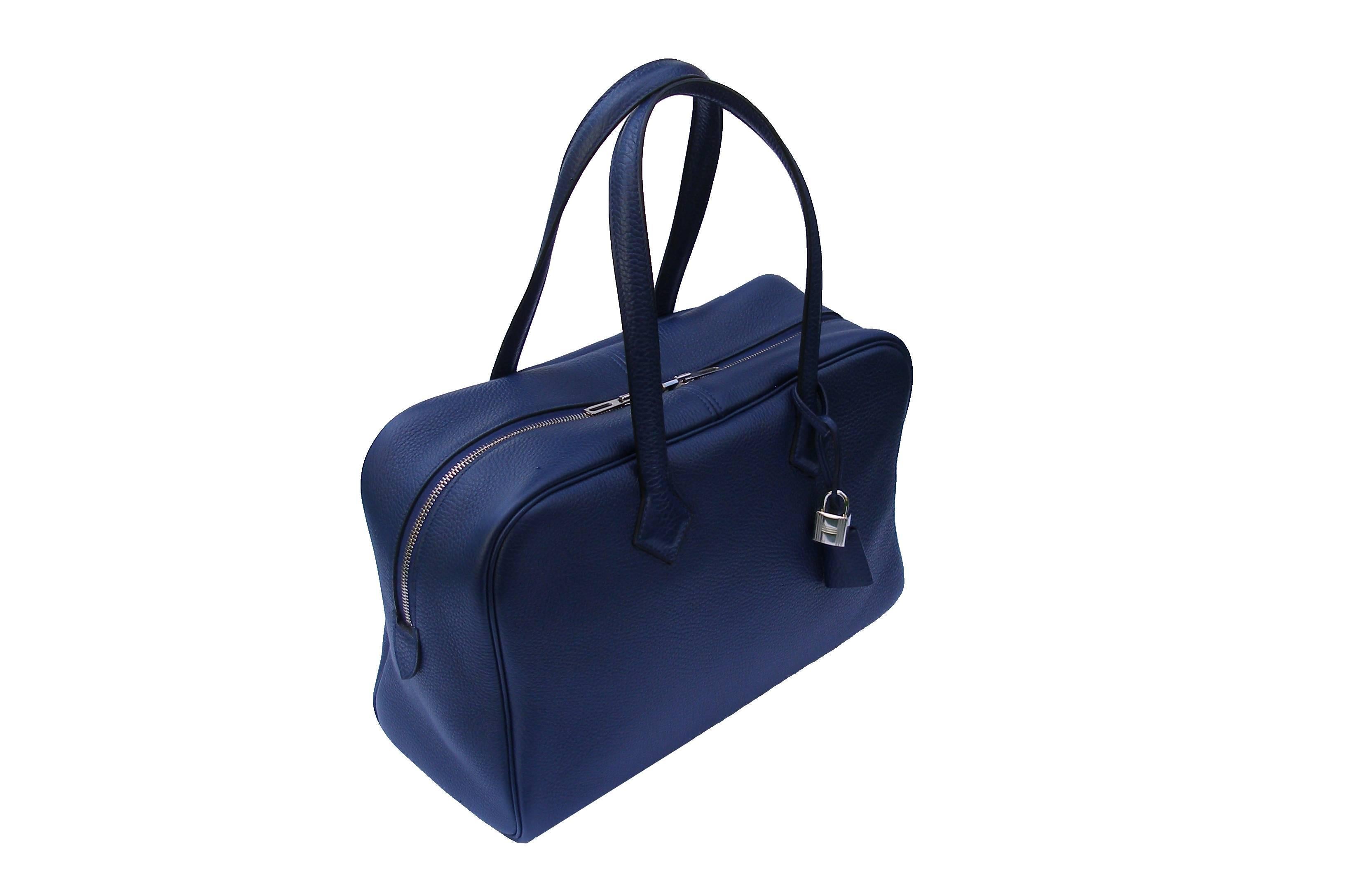 Impossible to find in this color BLEU SAPHIR 
Genuine 35cm Hermès Victoria II bag.  Featured in SAPHIR  Blue Clemence leather with palladium hardware.  Clemence leather is for those who prefers a less structured, slouchy feel.  The blind stamp