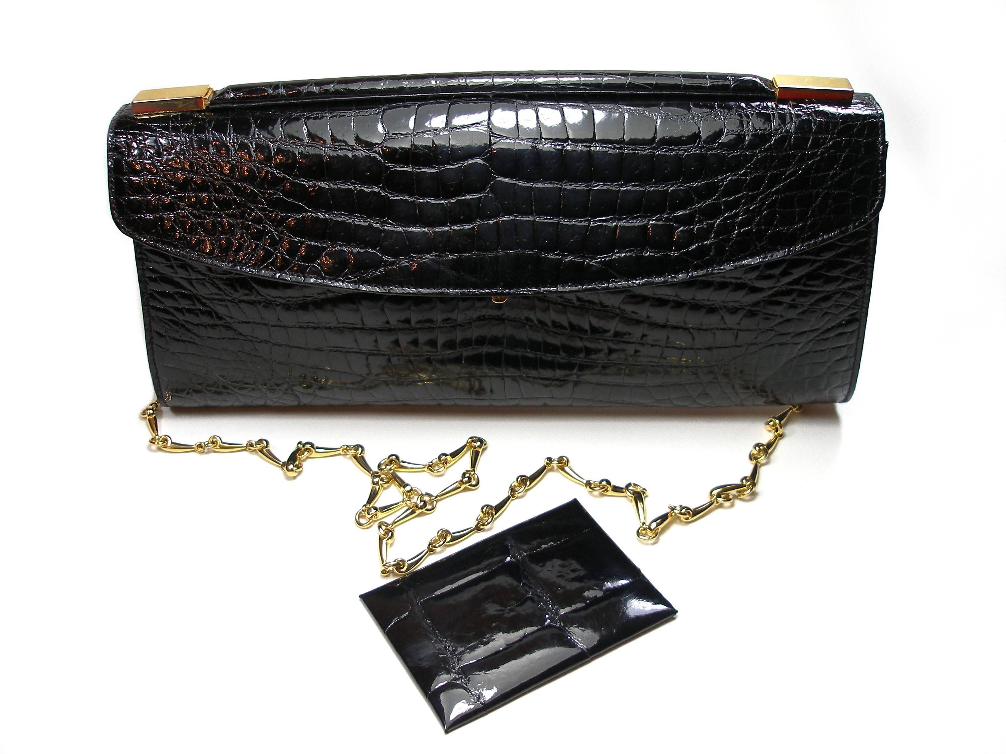Nice and Perfect compagnon !
Delvaux Clutch or Evening Bag
And small Pocket Miroir dimensions :  7 x 10 cm or 2.75 x 3.9 inches
Crocodile Leather 
Amovible chaine strap 
Dimensions :  31 x 14 x 4 cm or 12.2 x 5.5 x 1.57 inches
Strap : 103 cm or