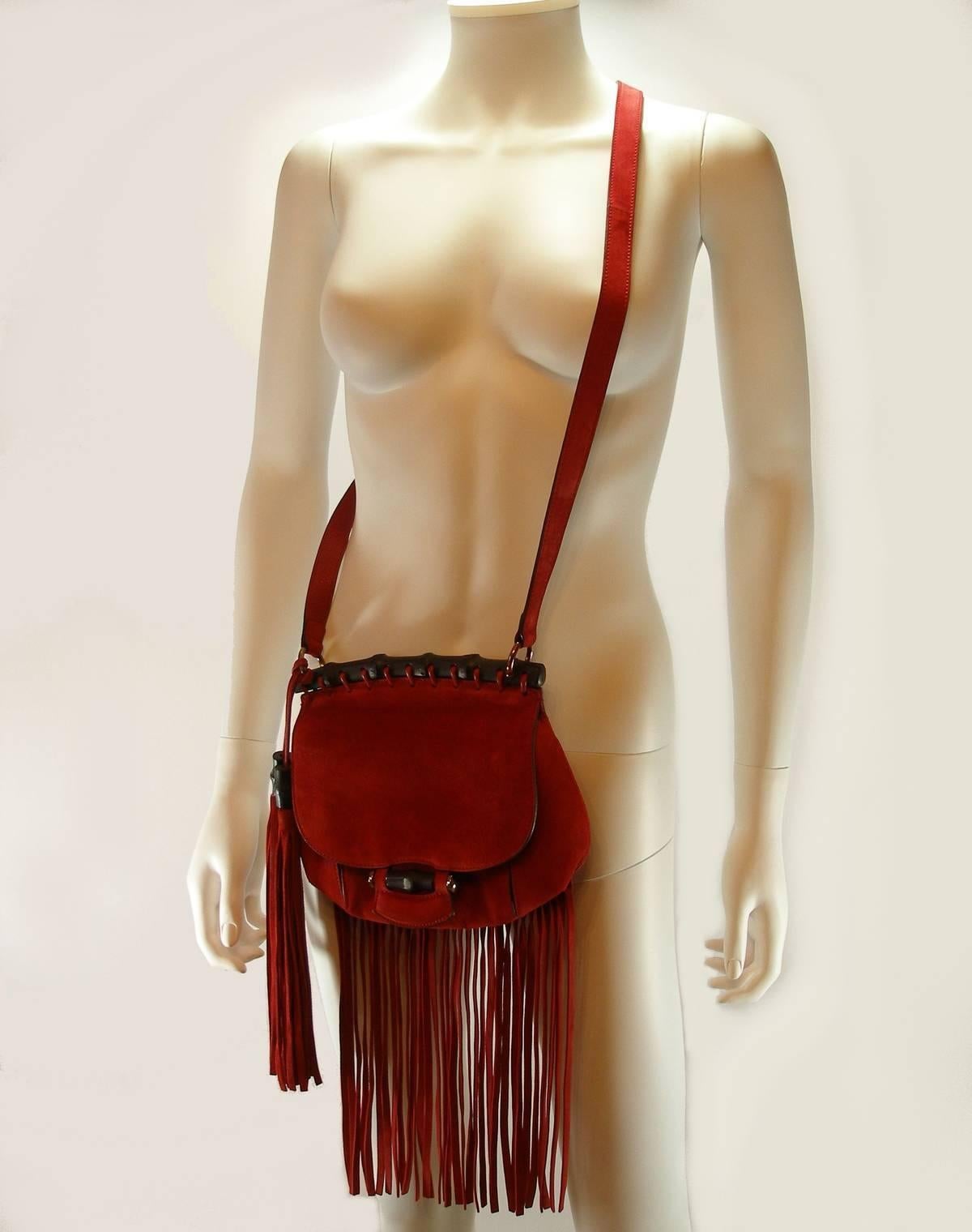 So cute, small Cross body / Shoulder bag Gucci 
This is a marvelous bag that is ideal for day or evening from Gucci! 
Suede leather 
Red color 
Adjustable strap , max 107 cm 
This bag is used but stays in good condition
Please look the many