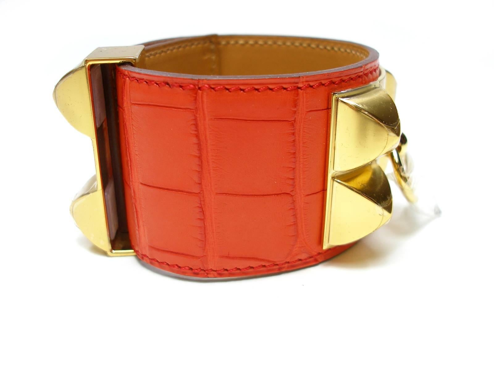 Hermès CDC Alligator mat 
Color Orange Poppy
Gold HDW
Adjustable
4 possibilités 16 cm à 19 cm or 6.29 to 7.48 inches 
Width : 4 cm 
Year X - Production 2016 
Plastic is still on gold plated hardware
Please note for this purchase : this bracelet
