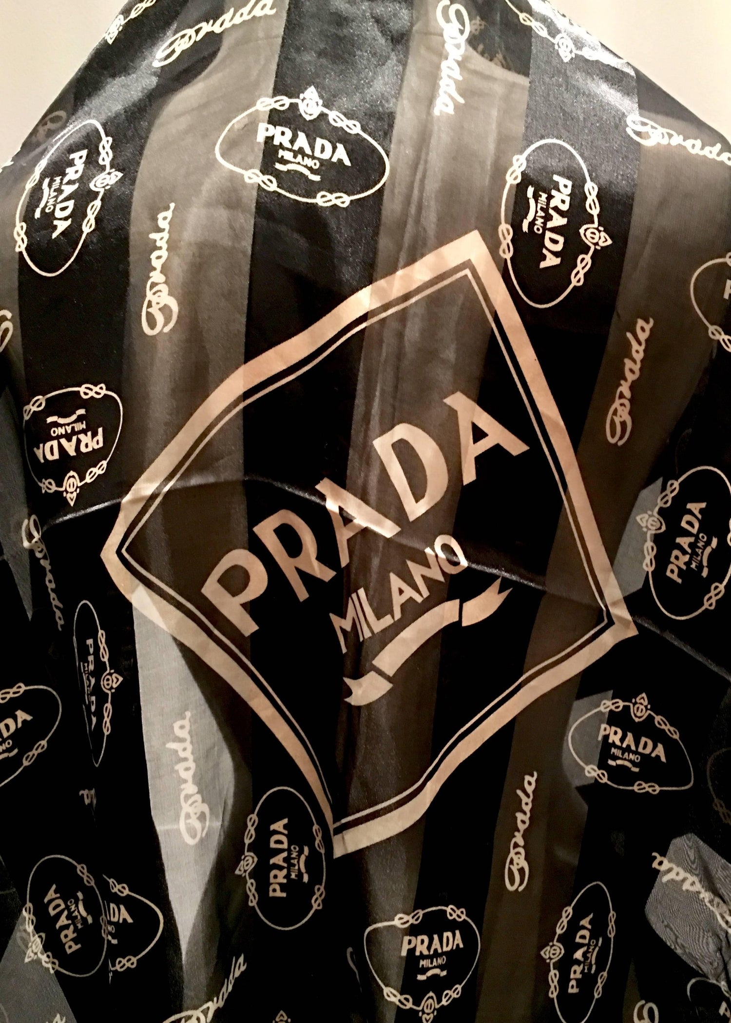 Vintage Prada Milano Logo Stripled Black and Gold Silk Chiffon Scarf at  1stDibs | prada milano silk scarf, prada milano scarf, prada silk scarf