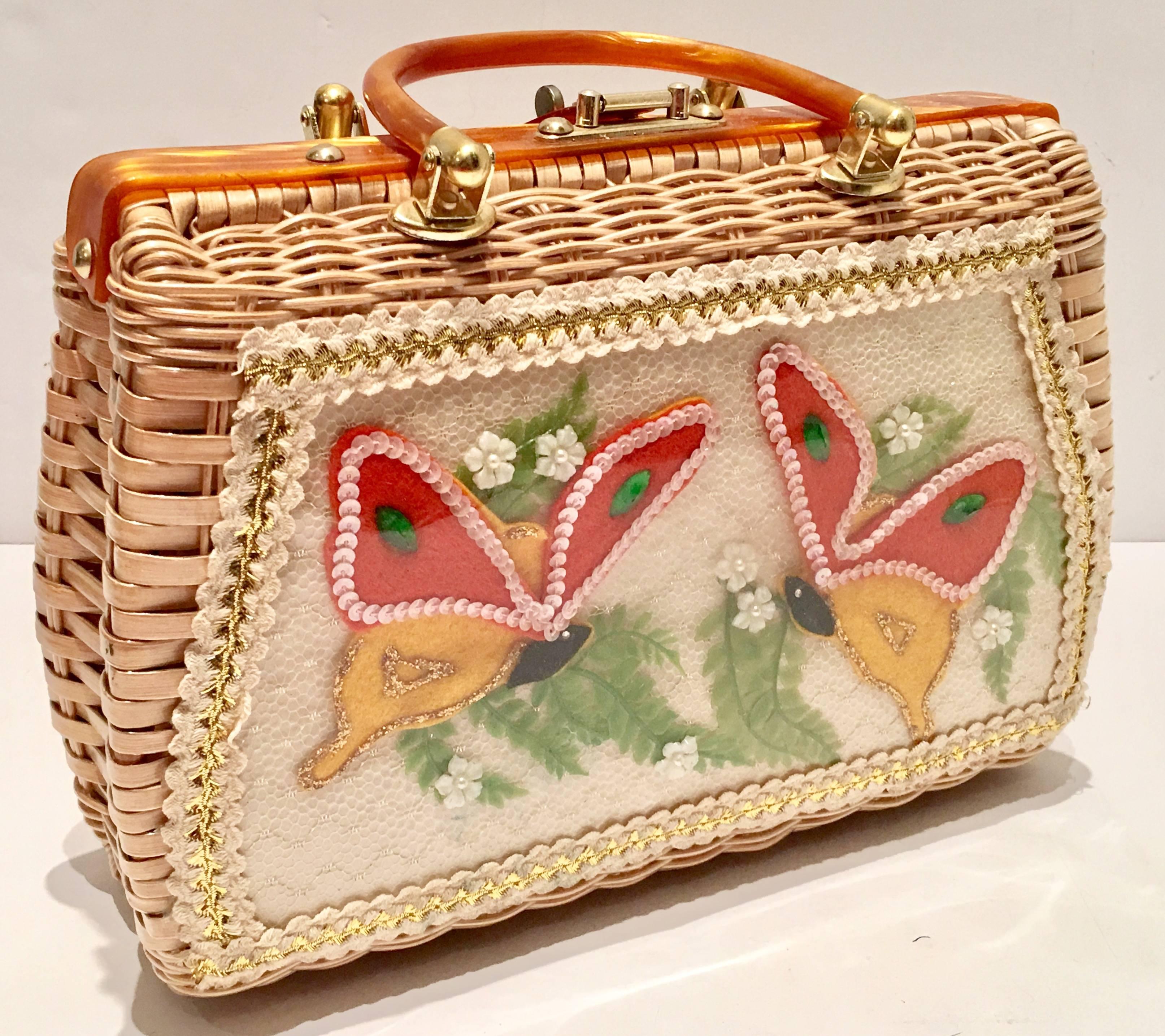 1960'S Chic & Trending woven wicker and Lucite tortoise tone handbag. This iconic 1960'S handbag features a front butterfly motif made of fabric applique under clear vinyl. Butterflies are crafted from felt, fern and flora and sealed under clear