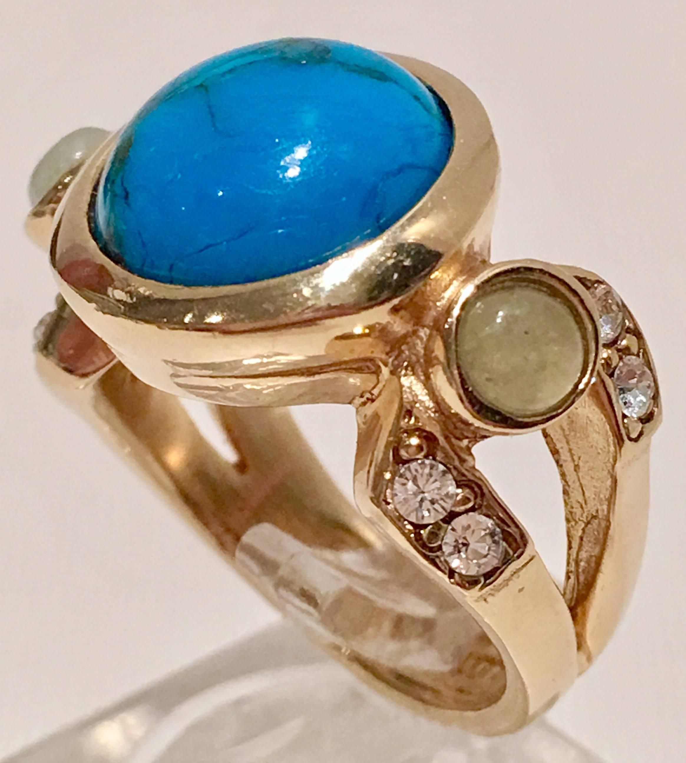 Contemporary Judith Leiber round turquoise center stone with two round green aventurine side stone and Austrian cut crystal stone detail. Features a gold plate over brass setting. Includes original Judith Leiber protective storage box. Ring Size