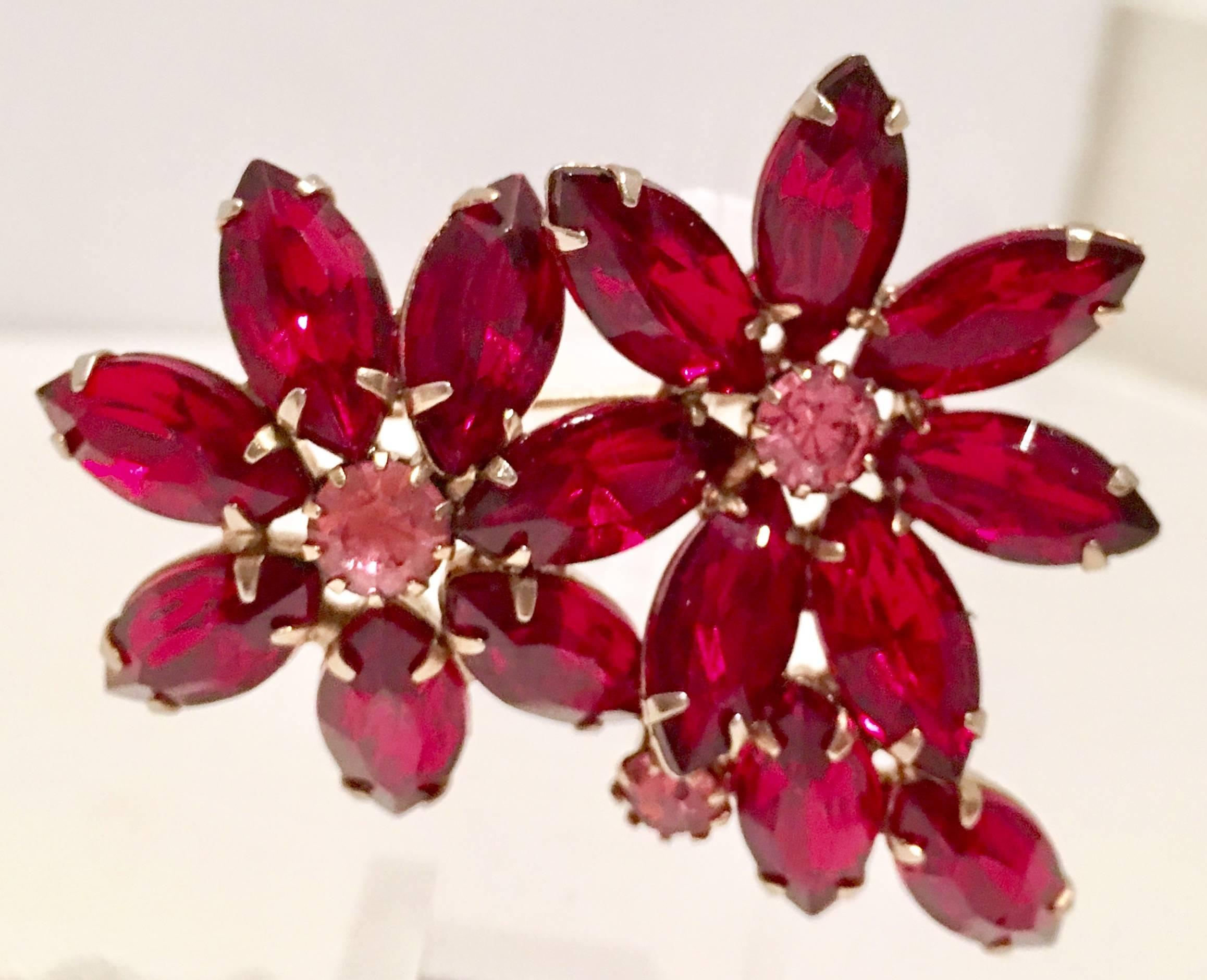 Brilliant prong set ruby and pink sapphire Austrian Crystal three dimensional double flower brooch, set in gold tone metal.