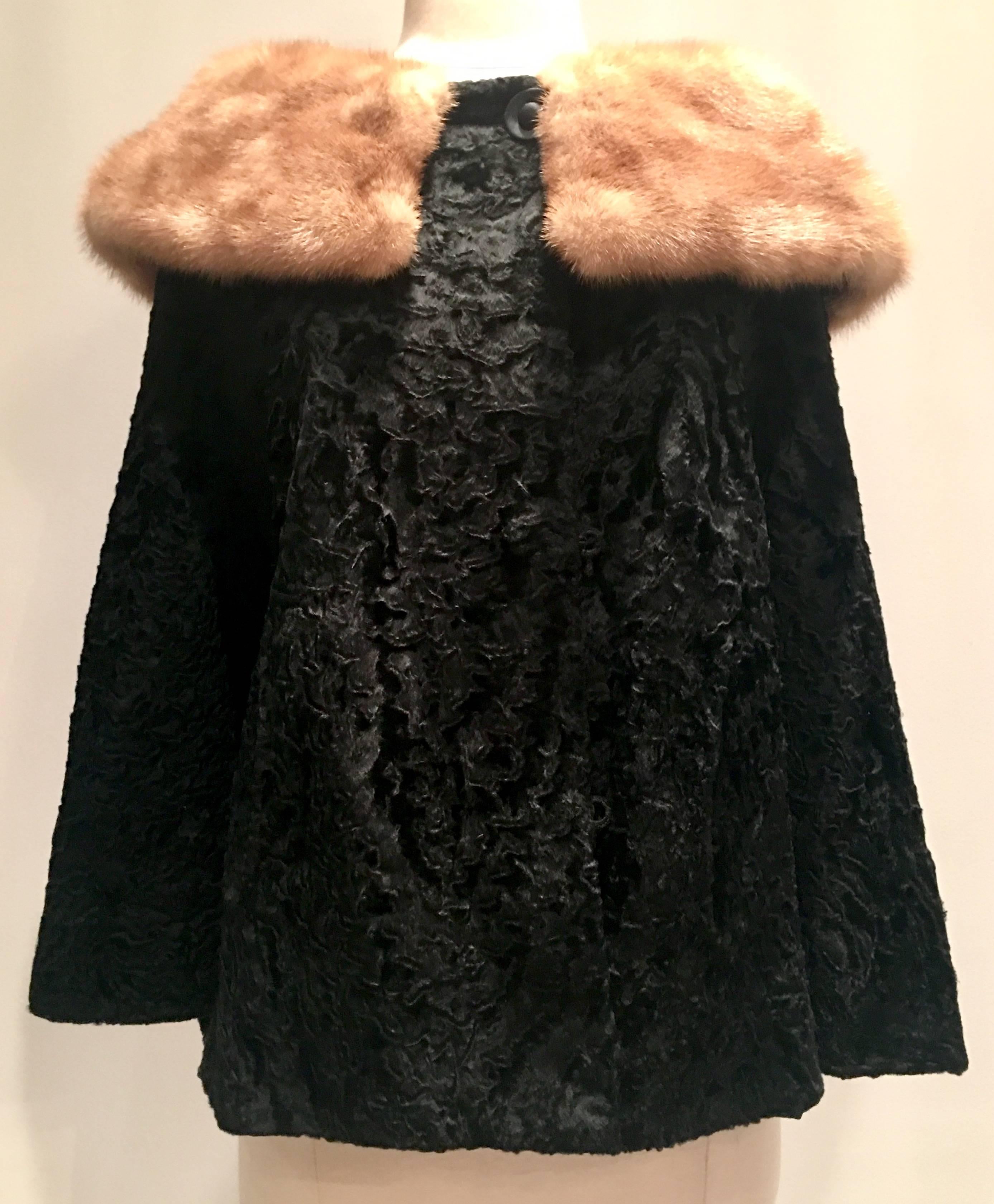 Gorgeous jet black Persian lamb and honey mink peter pan collar fur swing jacket with 3/4 inch bell sleeves. Features hidden satin wrapped buttons. There are two buttons at the collar, one at the neck and two at the front bodice. There are two