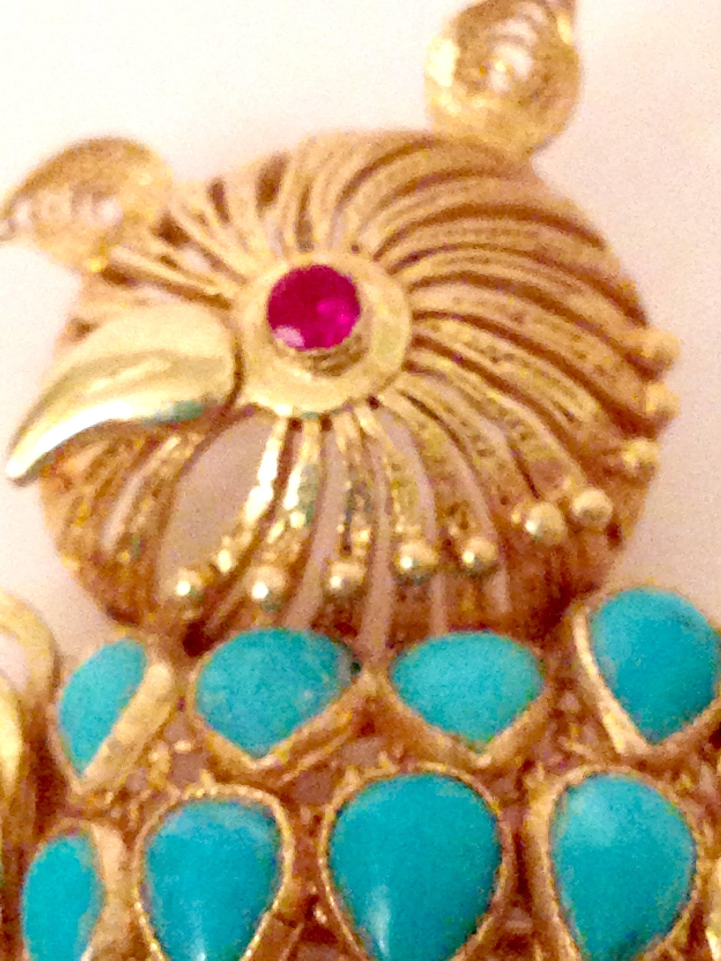 20th Century 14-Karat Gold filigree and bezel set authentic turquoise and authentic ruby owl perched on a branch brooch. This fantastic brooch is executed with twenty authentic turquoise bezel set stones and one 2.25mm authentic ruby. Signed on the