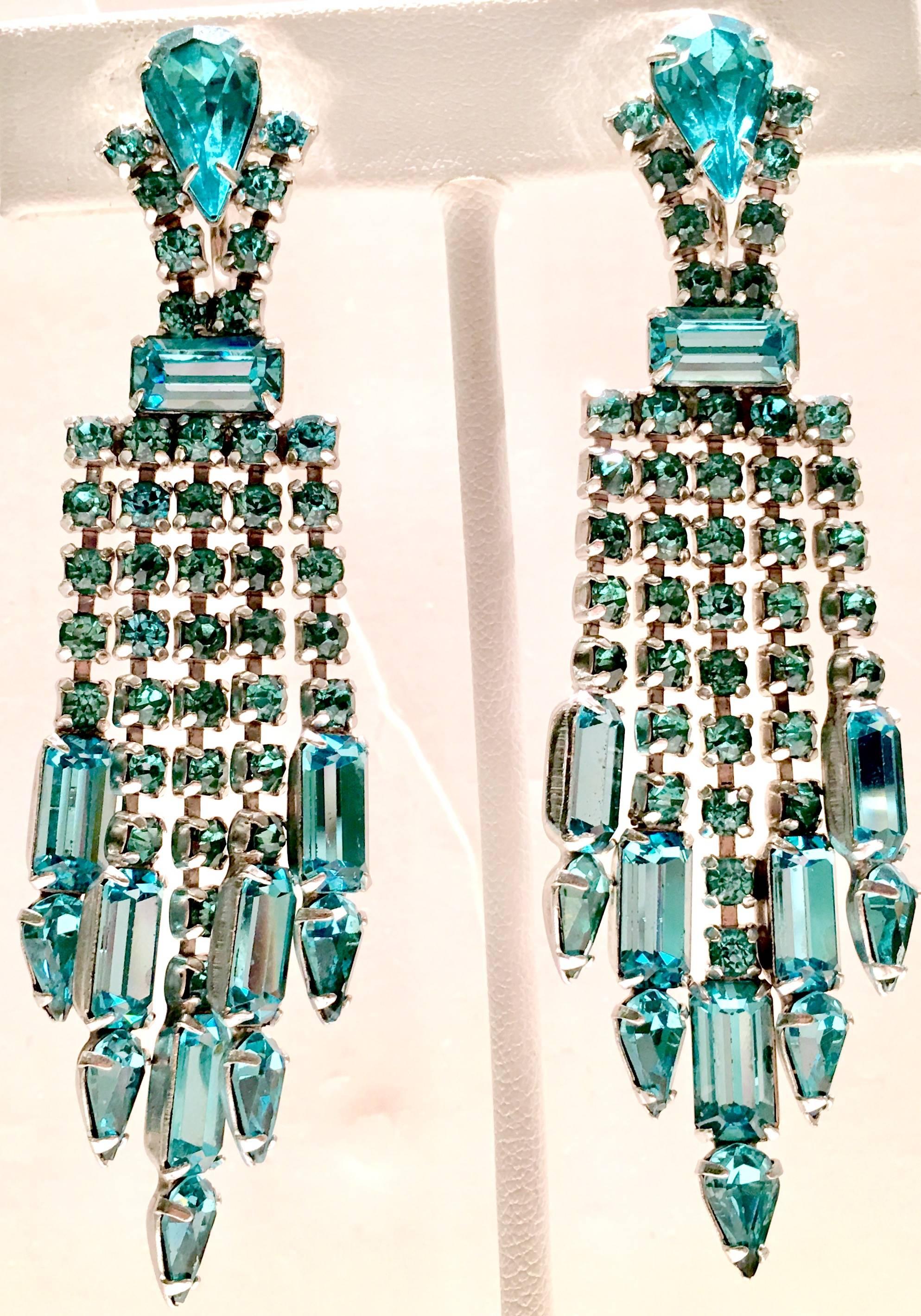 Sparkling 1960'S Weiss style blue sapphire Austrian crystal rhinestone, prong set dangling chandelier earrings. Set in silver tone metal, screw back style and unsigned.