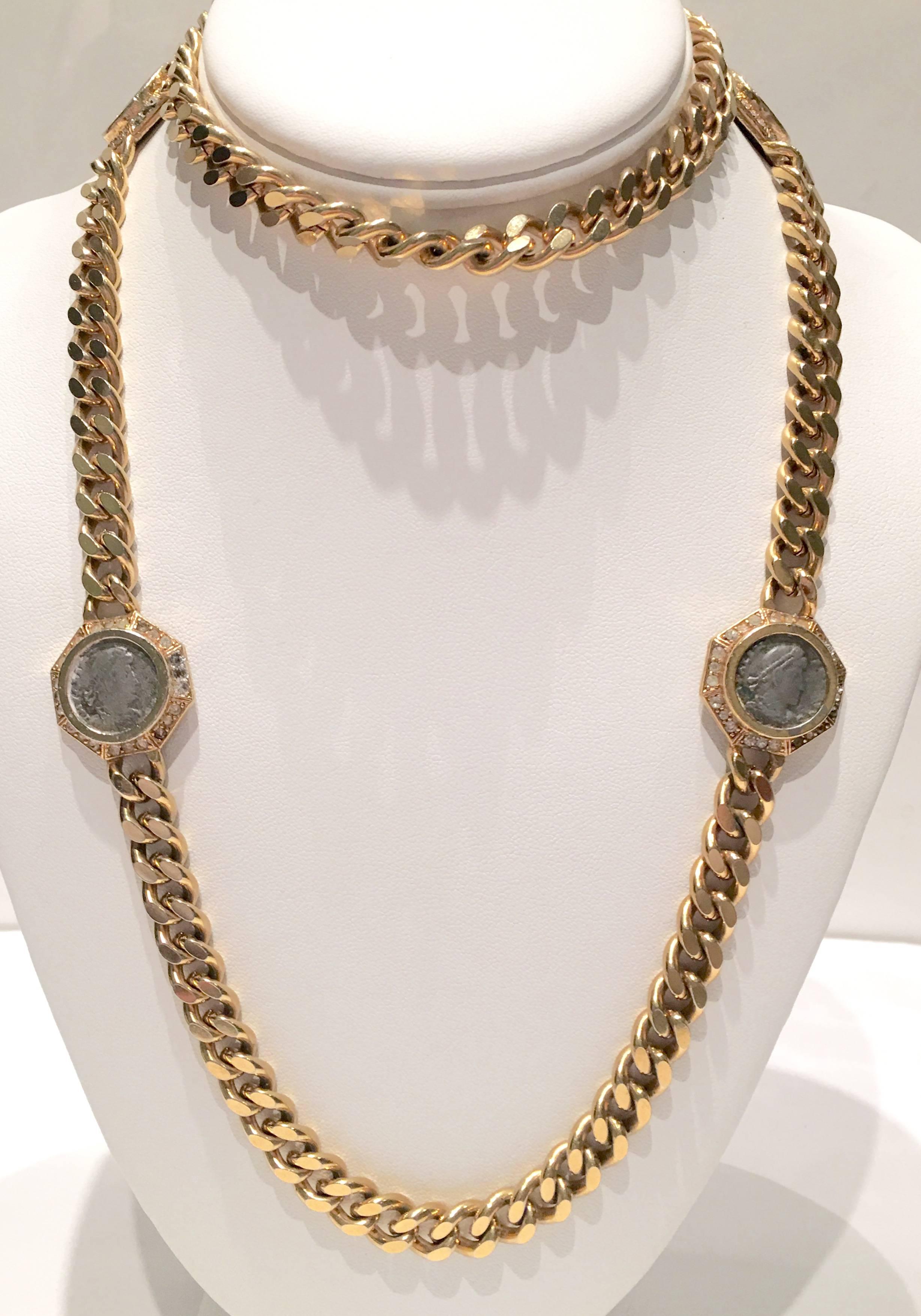 Vintage Ciner Opera-length 18K yellow gold-plated chain link rope necklace with pewter faux-Roman coins surrounded by pavé set Austrian crystal clear rhinestones. Each of the four 1