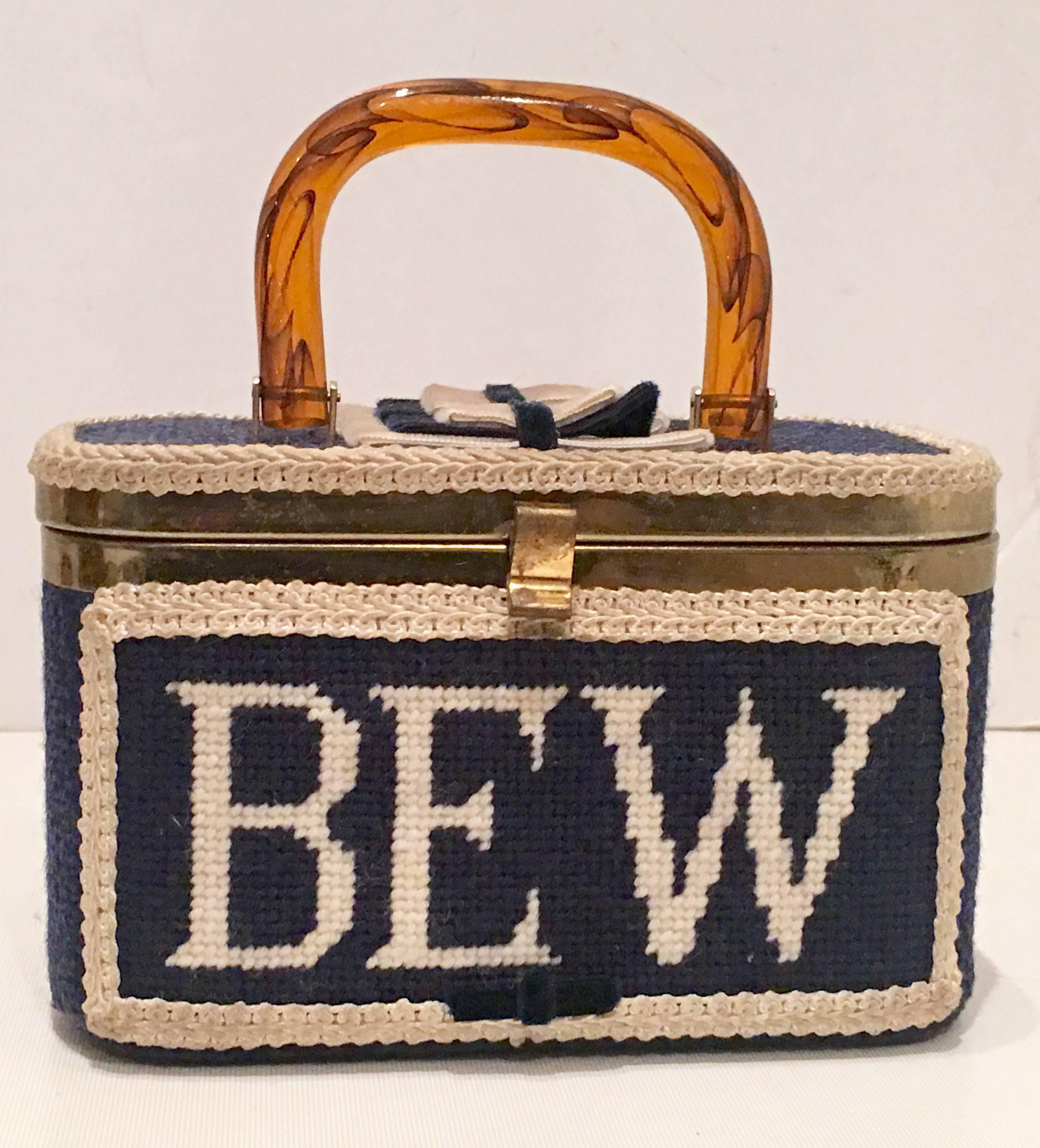 1050'S Collectible & Adorable JR Florida Box Style Navy Blue & White, Crewel Monogrammed Box Style Hand Bag with Tortoise colored Lucite Carrying Handle. The Exterior is finished with crochet trim and velvet bows. The Needlepoint Monogram reads
