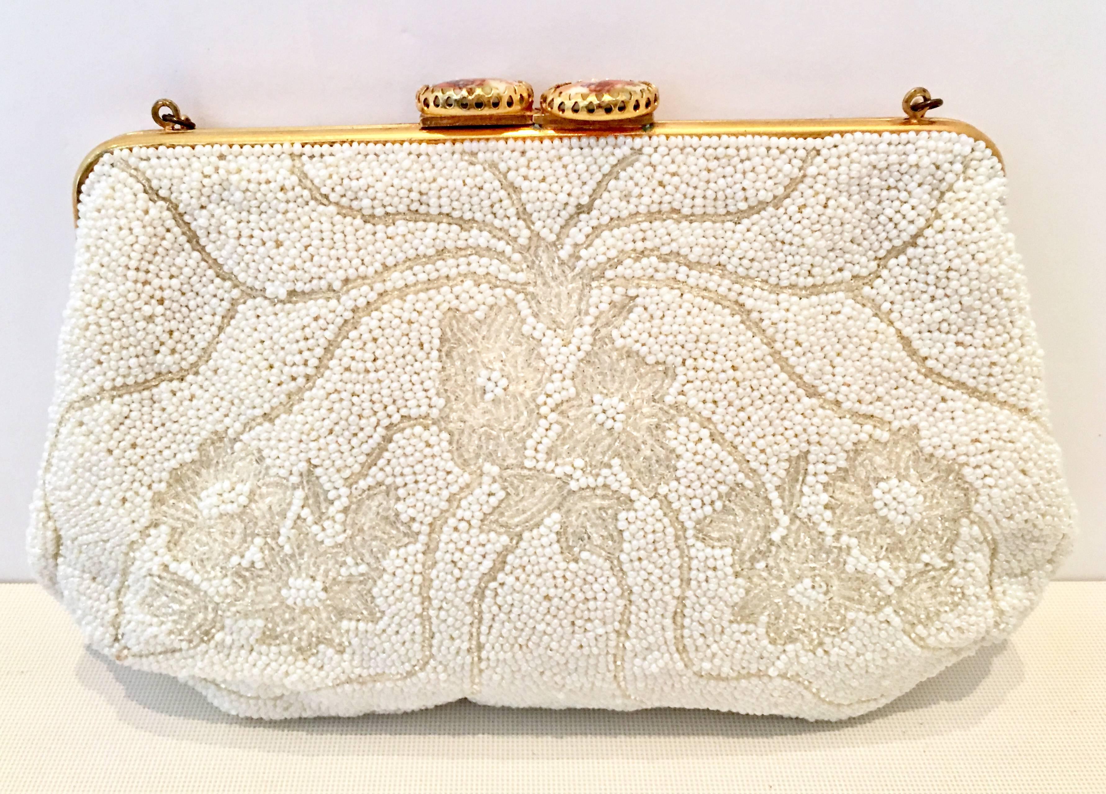 1950'S French Hand Made Art Glass Beaded, Gold Gilt & Limoges Porcelain Evening Bag By, Leo Miller. This delicate and intricate hand beaded piece features off white opaque and translucent art glass beads in a simple abstract floral motif. The frame