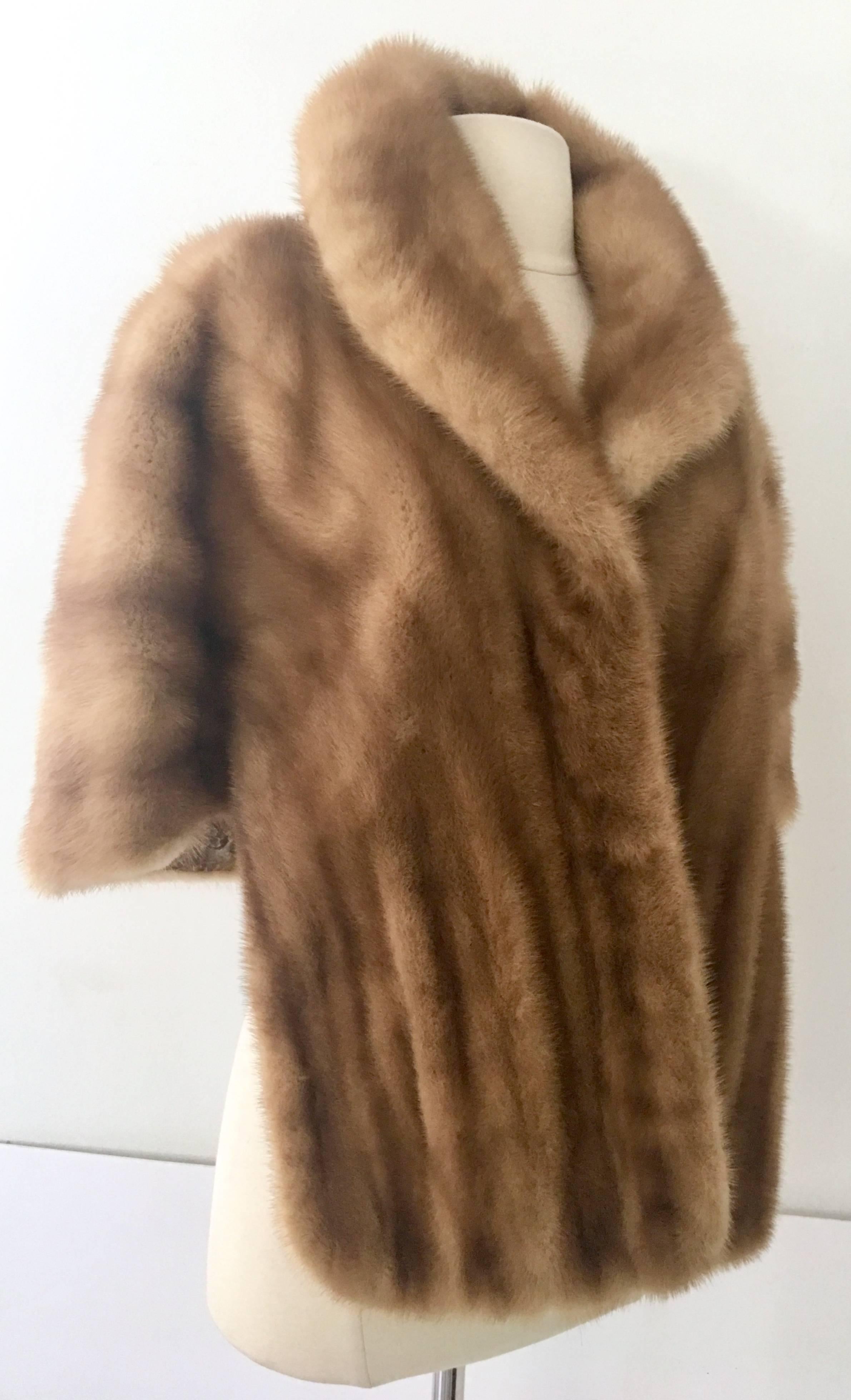 Mid-Century Very Fine whiskey dyed mink fur capelet jacket. This unique and pristine piece features two side pockets. This custom made one of a kind piece was commissioned by the original owner to have a custom fitted interior lining of hand sewn