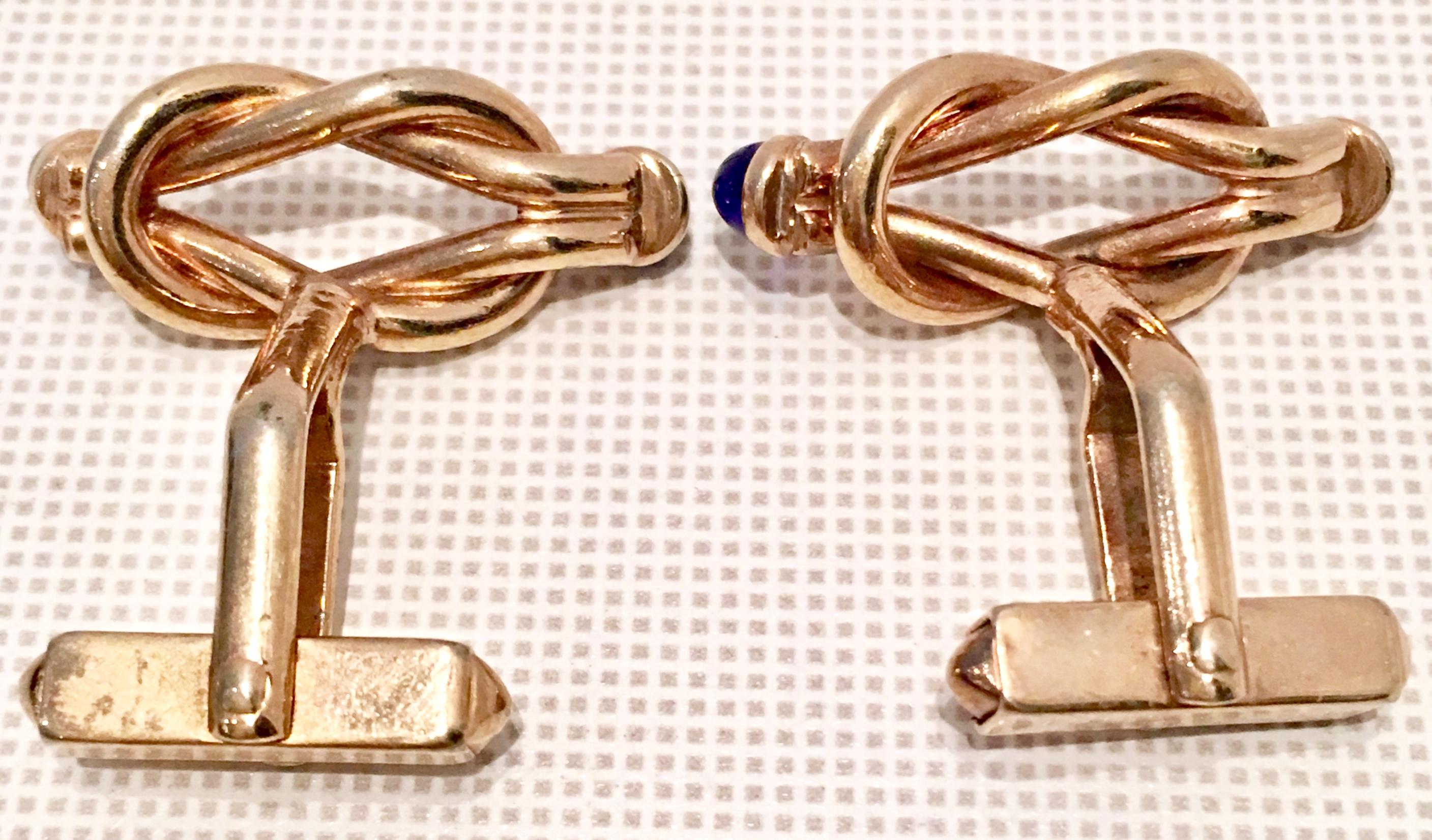 gold and blue cufflinks