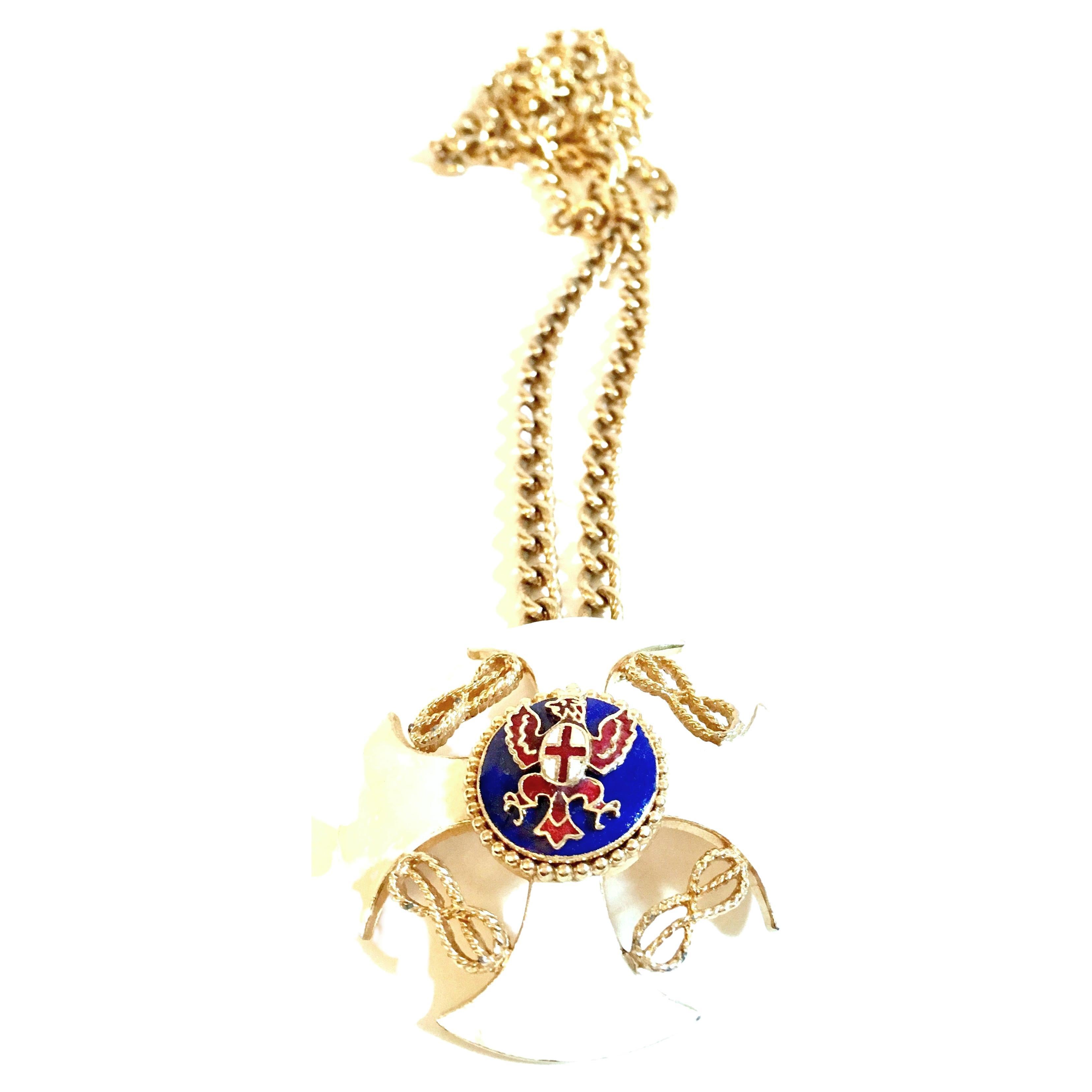 20th Century Gold & Enamel Crest Cross Brooch & Pendant Opera Length Necklace By, Monet. This gold plate opera chain link necklace features a large enameled pendant or brooch with a curved nautical themed cross with gold rope and bead detail. The