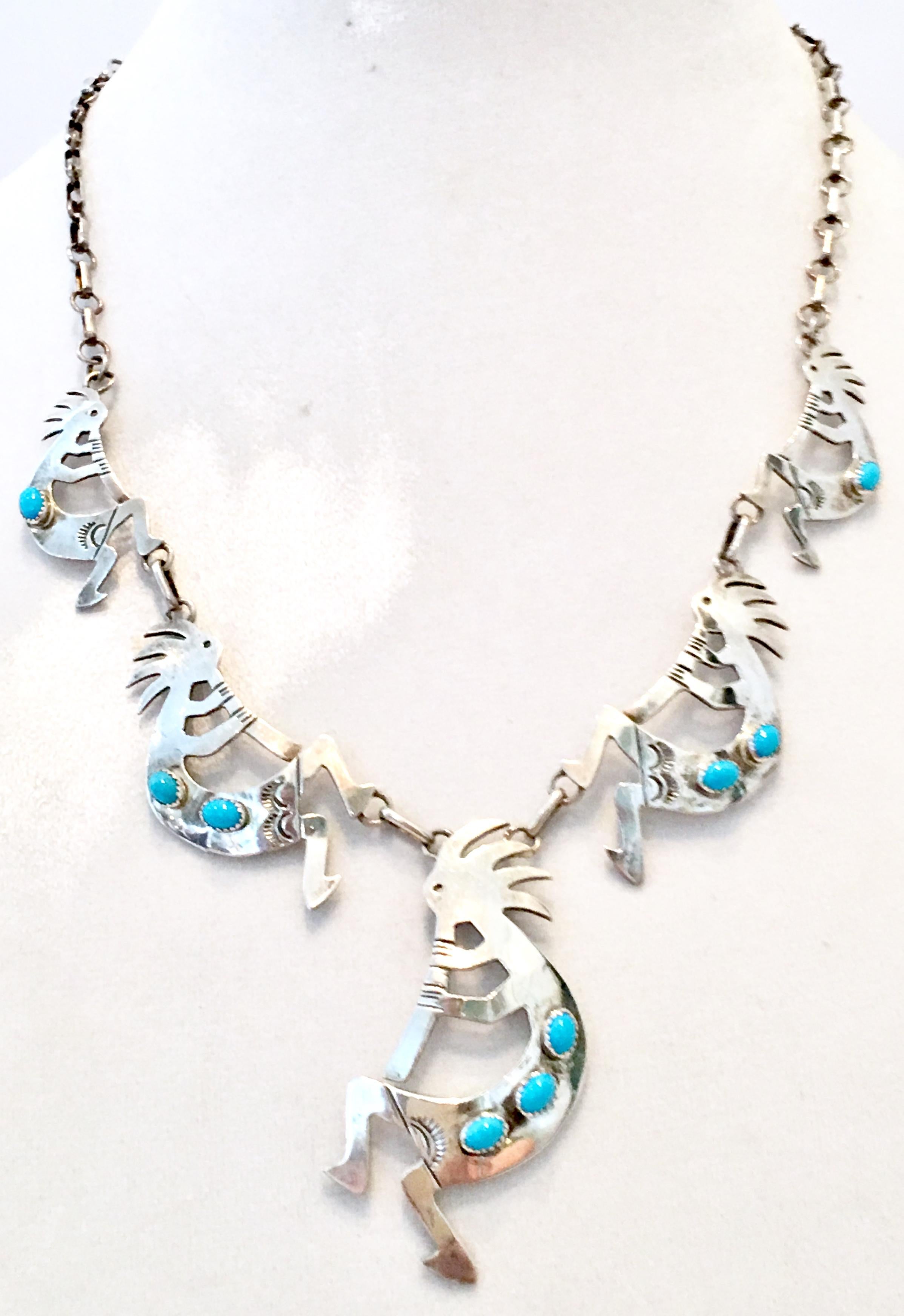 20th Century Navajo sterling silver & turquoise Kokopelli Kachina figural fertility necklace. Necklace features five Kokopelli Kachina and nine turquoise beads. Kokopelli range in size from 2.5