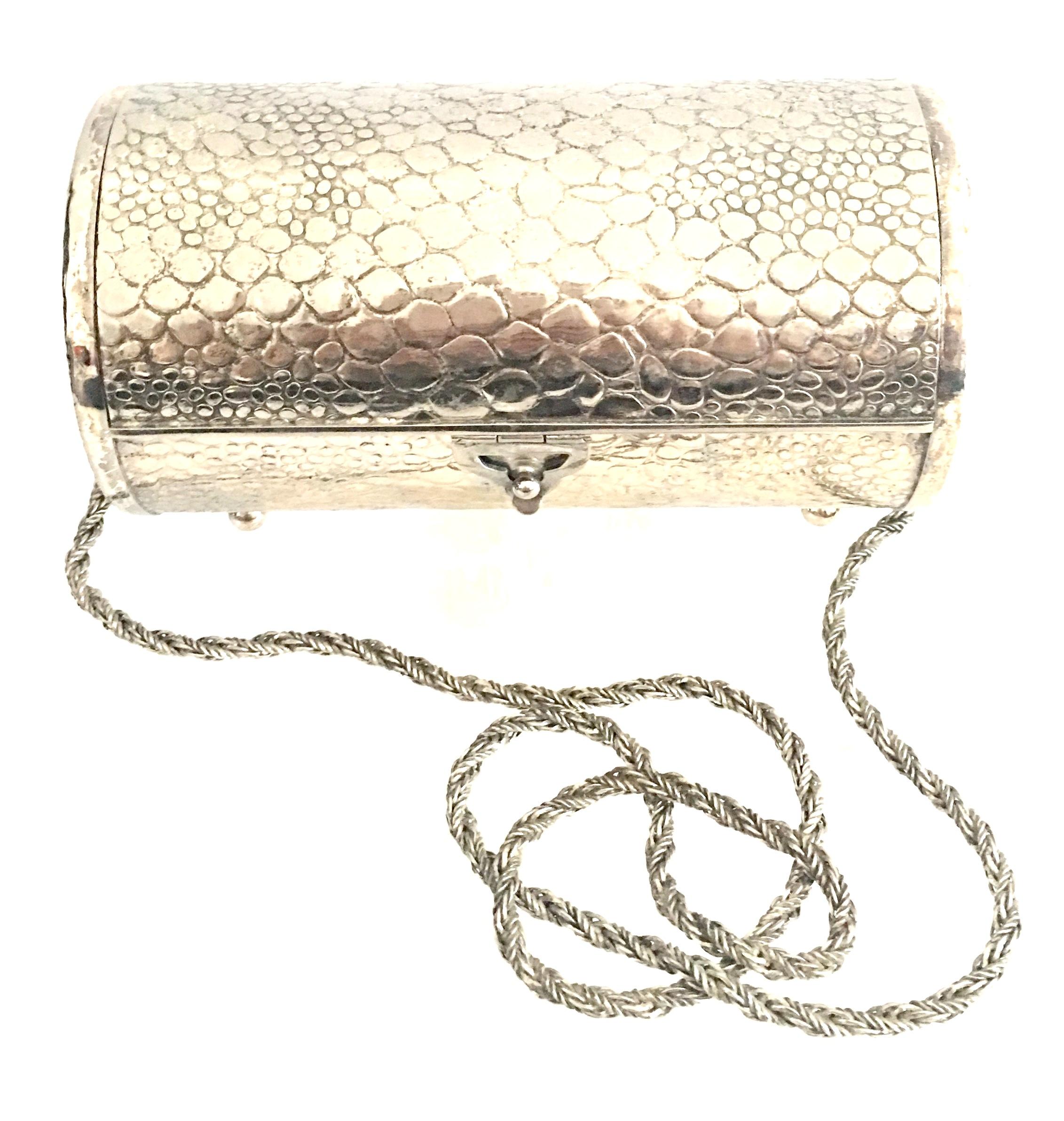 1980'S Silver plate tootsie roll shaped hard case box style clutch and shoulder evening bag made in Italy for, Morris Moscowitz. Crocodile embossed detail. Blue velvet lining with original manufacture tag in tact. Silver chain shoulder strap with a
