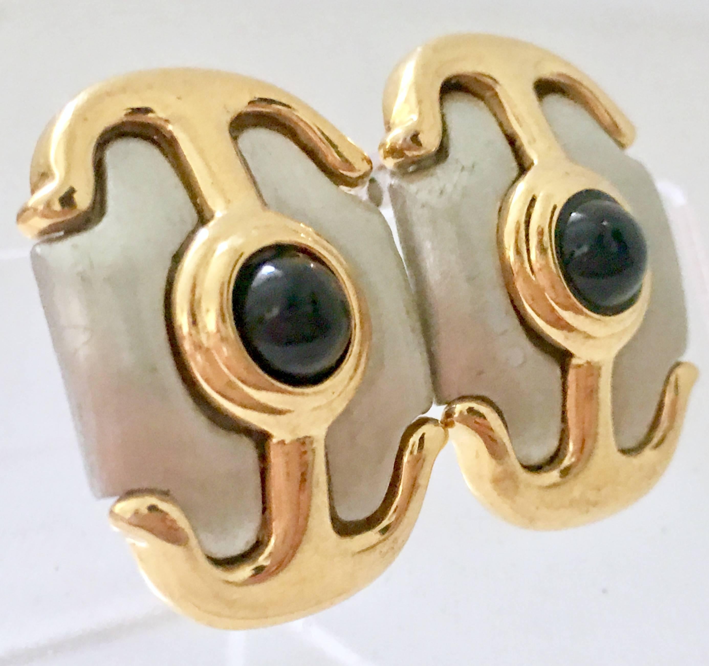 1980's Guy Larouche brushed silver and gold plate glass onyx stone anchor motif clip style earrings. Each piece is signed Guy Larouche on the backside in two places. 