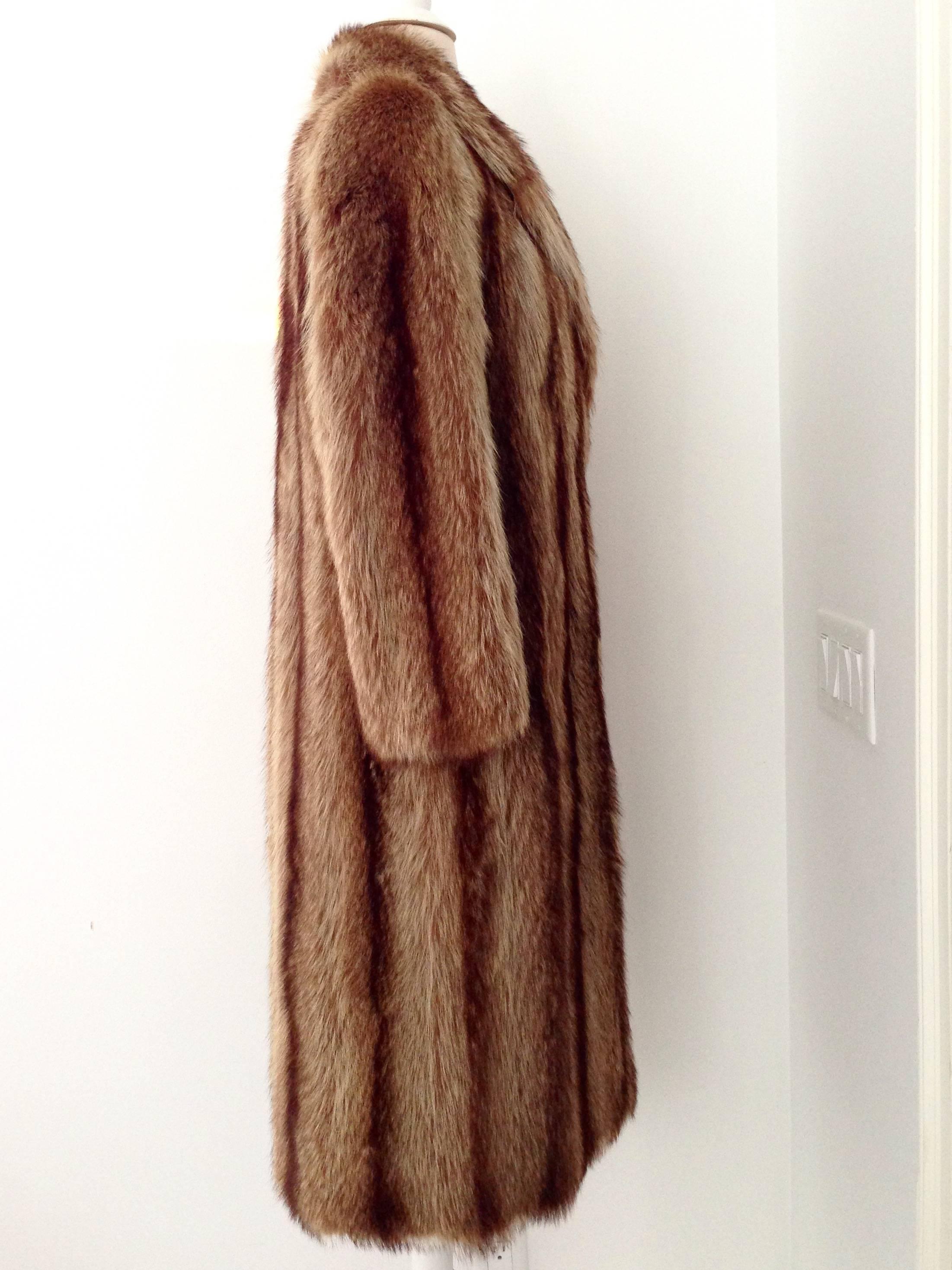 Chloe designer Raccoon fur coat for Goldin-Feldman furriers. Carmel and chocolate ombre in color, fully lined with and interior robe style belt and fringe bottom edge detail. Two-side pockets and one hook closure at chest. Chloe tag intact fits like