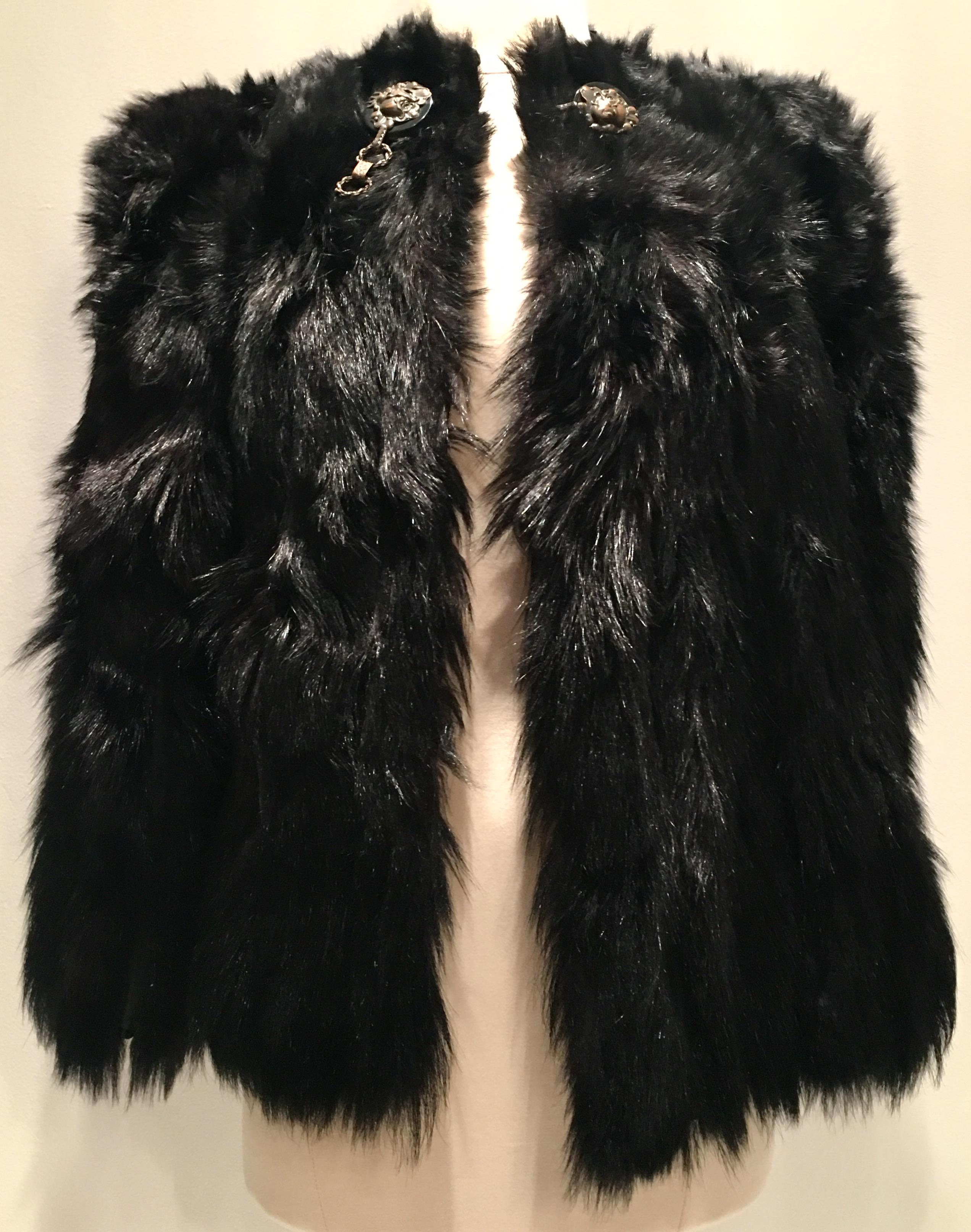 20th Century Rare shimmering jet black authentic monkey fur jacket. This transitional, goes with everything piece features a toggle style brass Art Nouveau floral big button closure at the neck and one invisible hook at the center chest. Each pelt