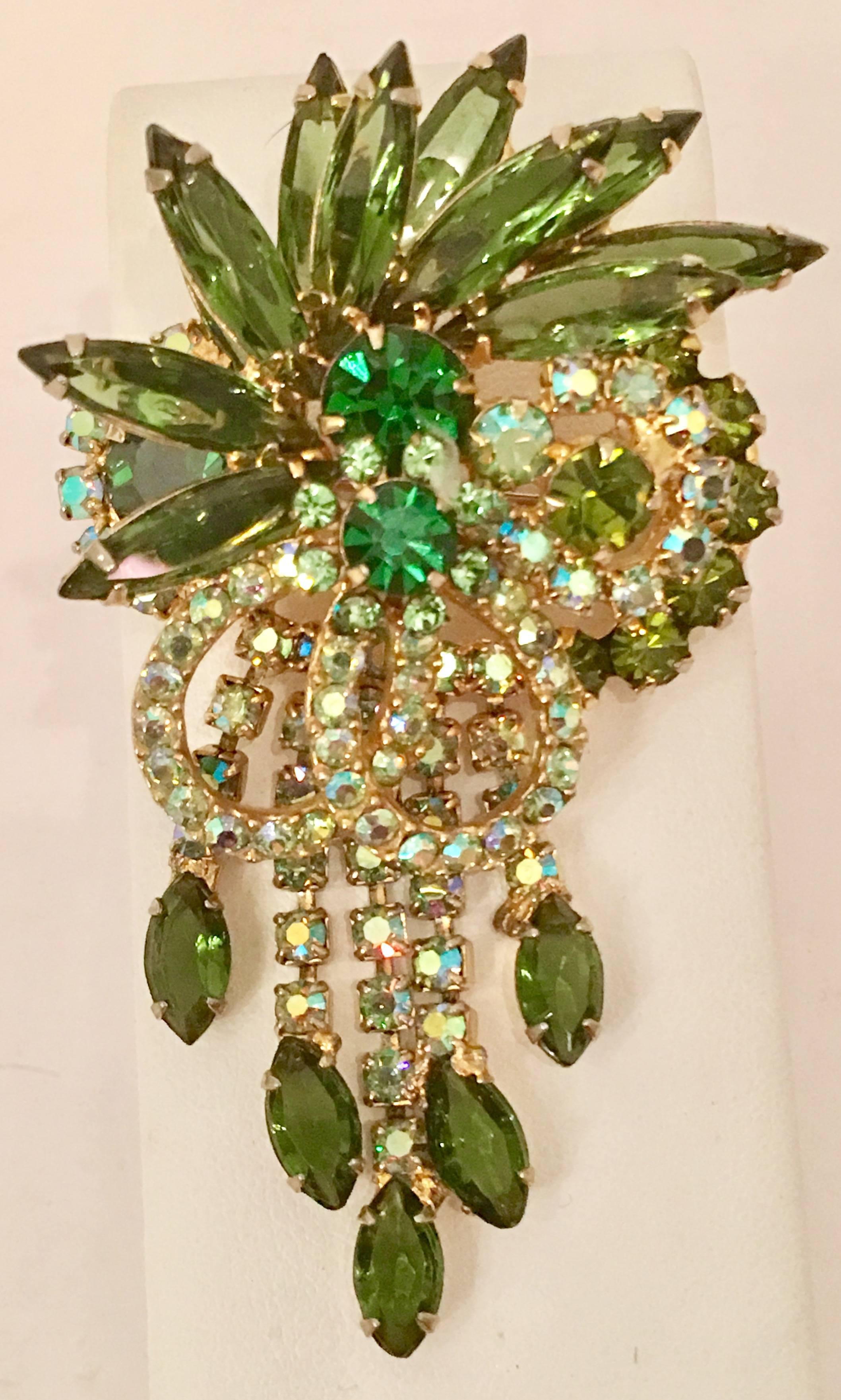 1960'S Delizza & Elster-Julian gold tone metal prong set with Austrian crystal rhinestones in periodot and aurora borealis rhinestones, brooch and necklace slide. Three dimensional with a .50" inch projection. The underside includes a bale