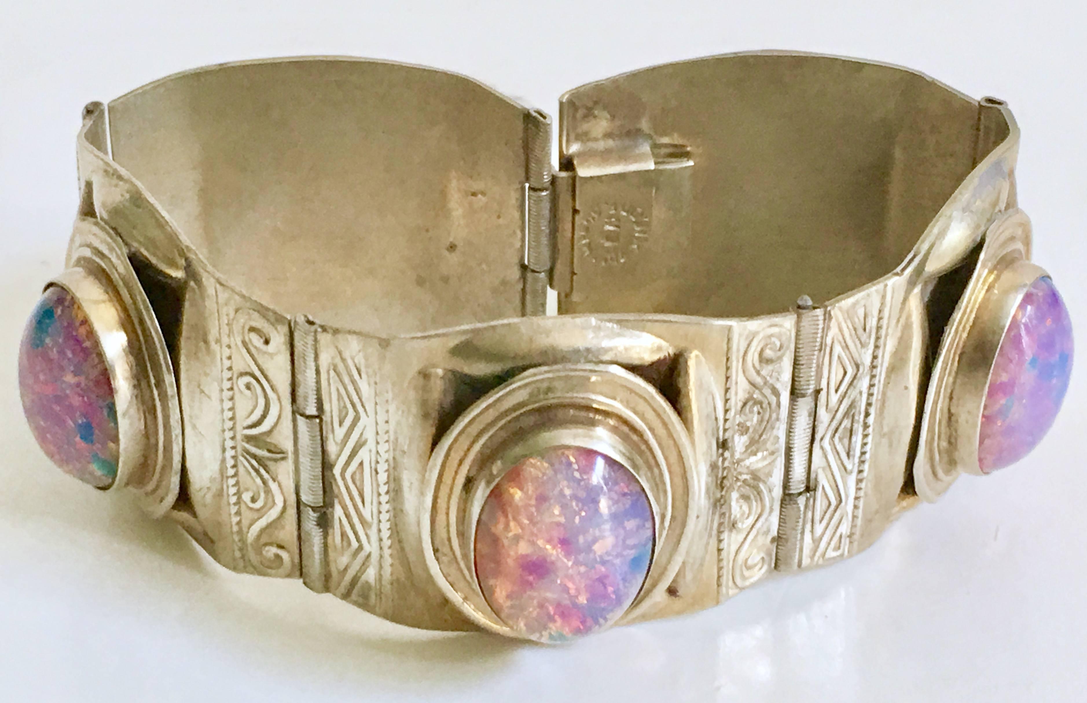1940'S Sterling Silver Taxco Art Glass Pink & Lavender Foiled Fire Opal Five Panel Bracelet. This wonderfully executed piece features five large bezel set art glass fire opal stones. Each stone is approximately, .75
