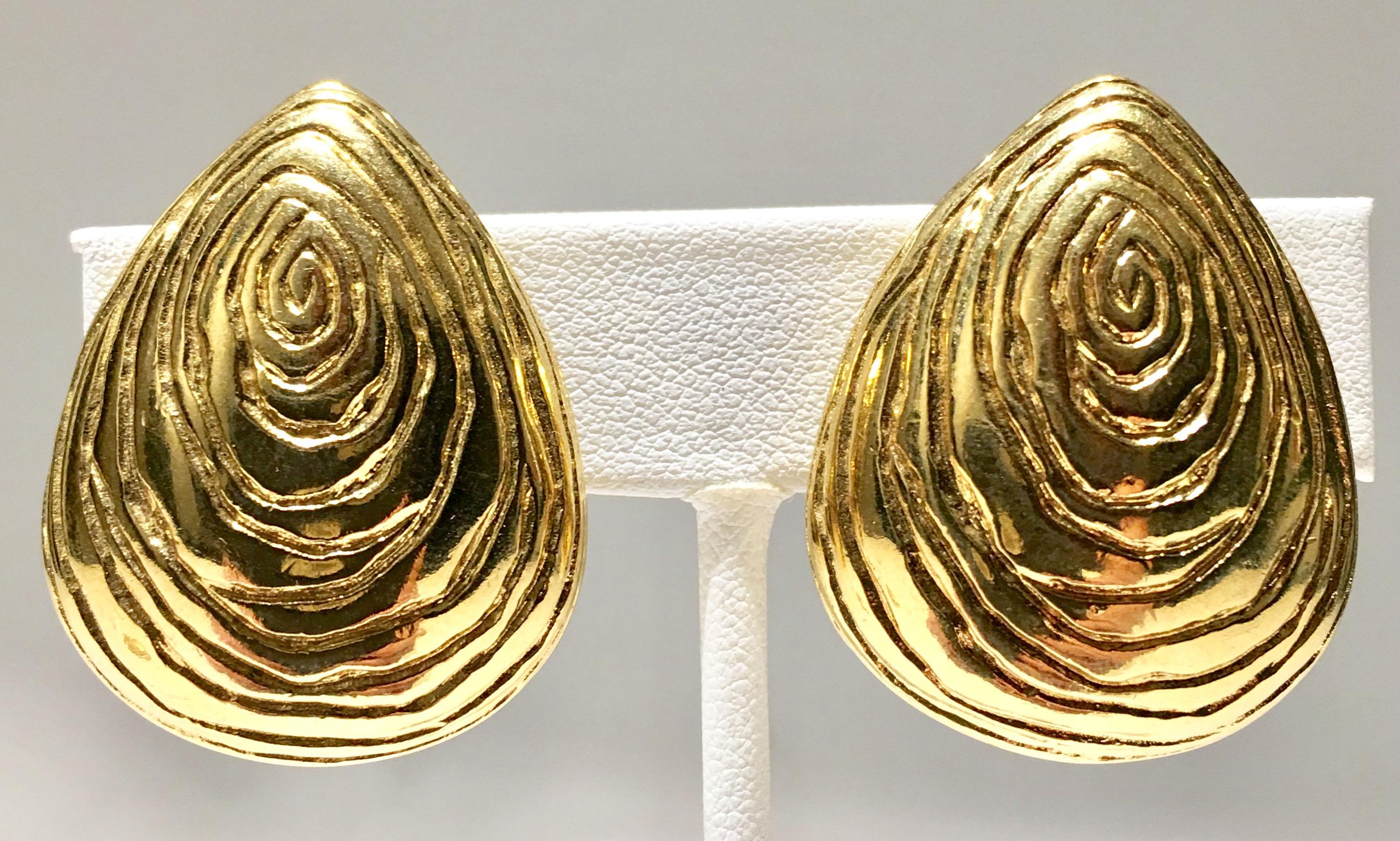1980'S Givenchy gold plate faux bois clip style earrings. Singed on the underside, Givenchy Paris-New York.