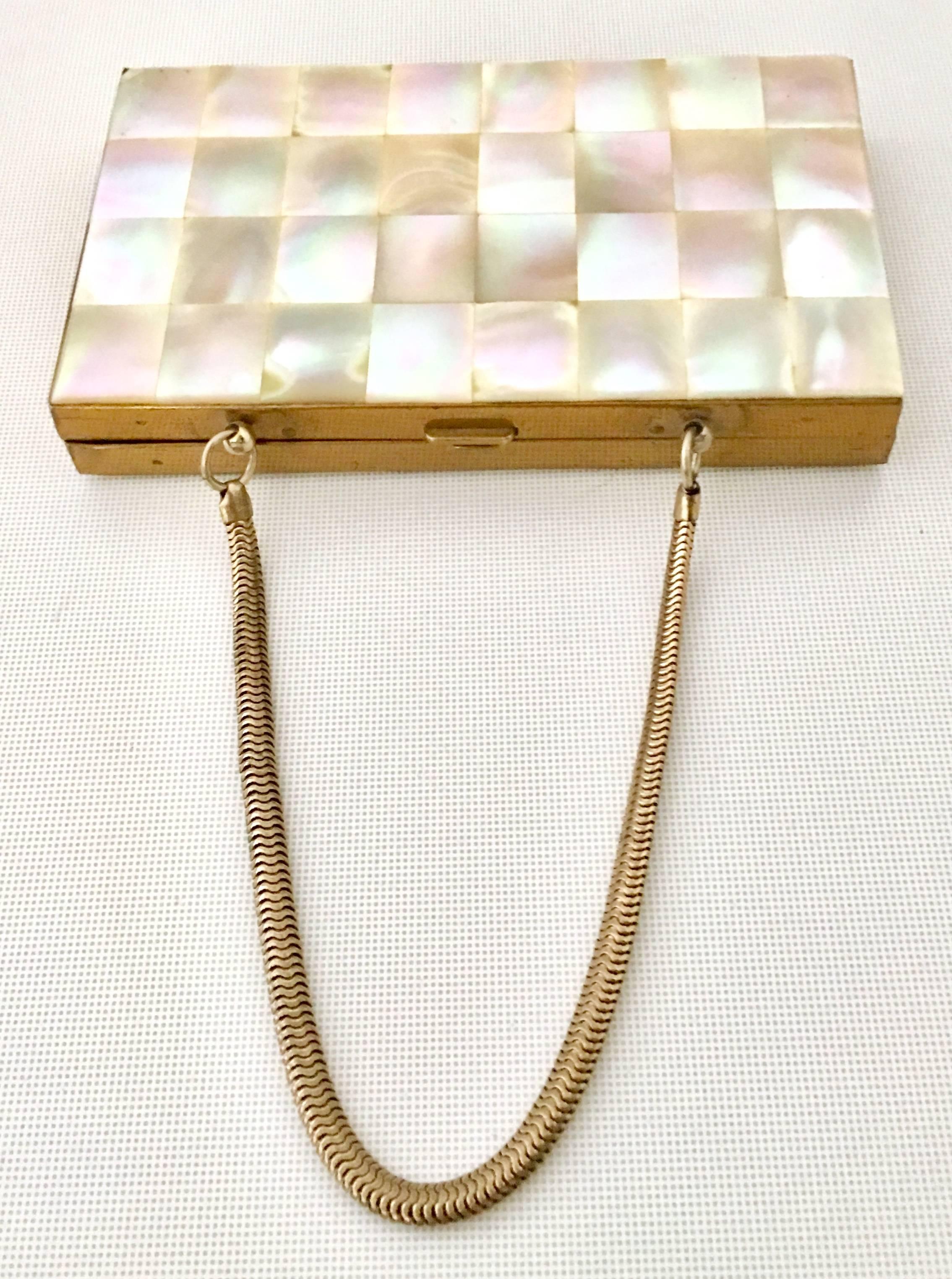 1940'S Exquisite & Rare Double Sided Mother Of Pearl and Brass Minauiere Compact. This checker pattern, double sided hard case finished in mother of pearl brass compact features a coil snake handle of gold plate and a interior with 
