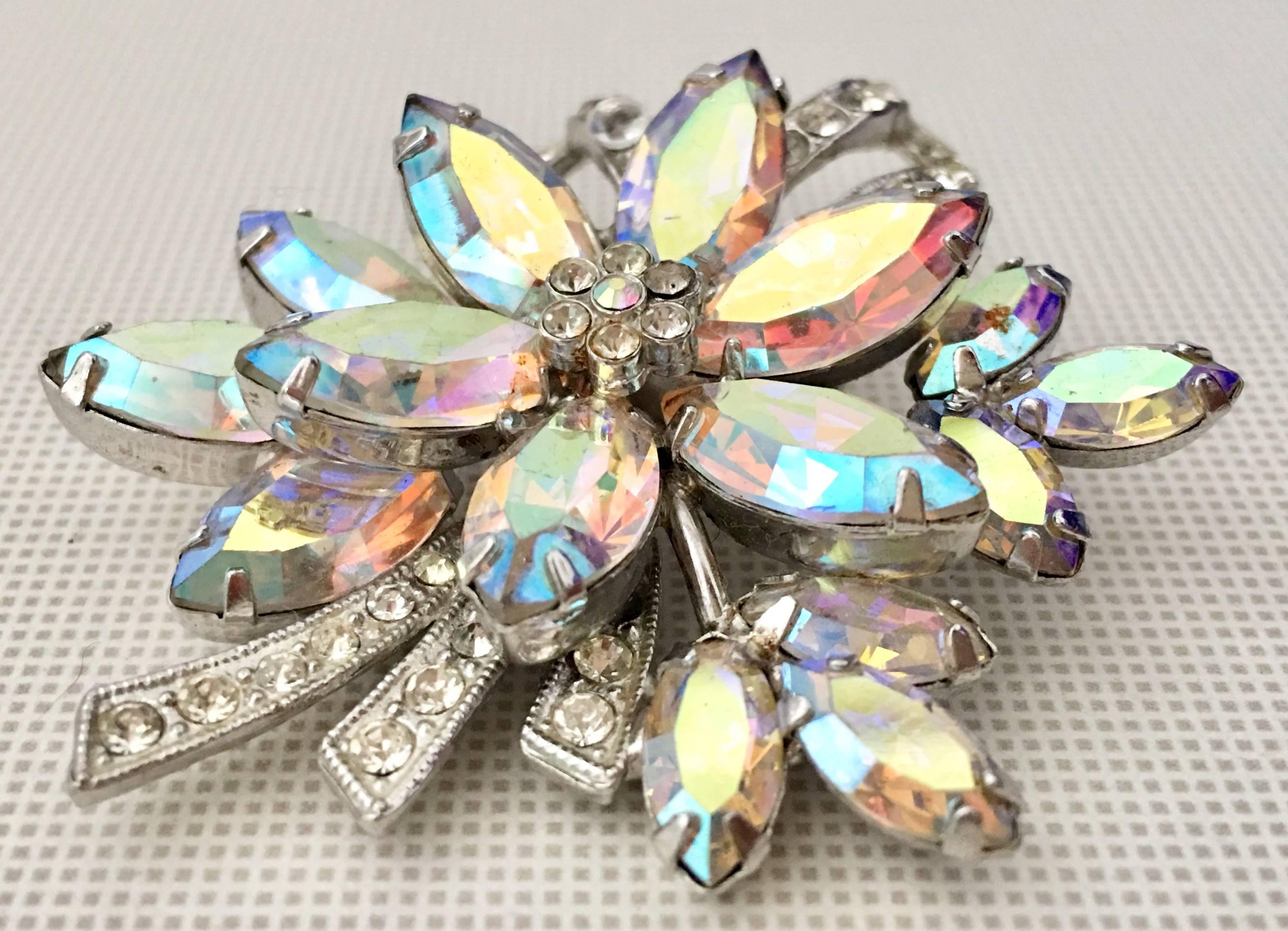 Vintage Aurora Borealis & Crystal Clear Austrian Crystal Rhinestone Dimensional Flower Brooch By, Weiss. This dimensional flower brooch features silver rhodium plate prong set rhinestones and is signed on the underside, Weiss.