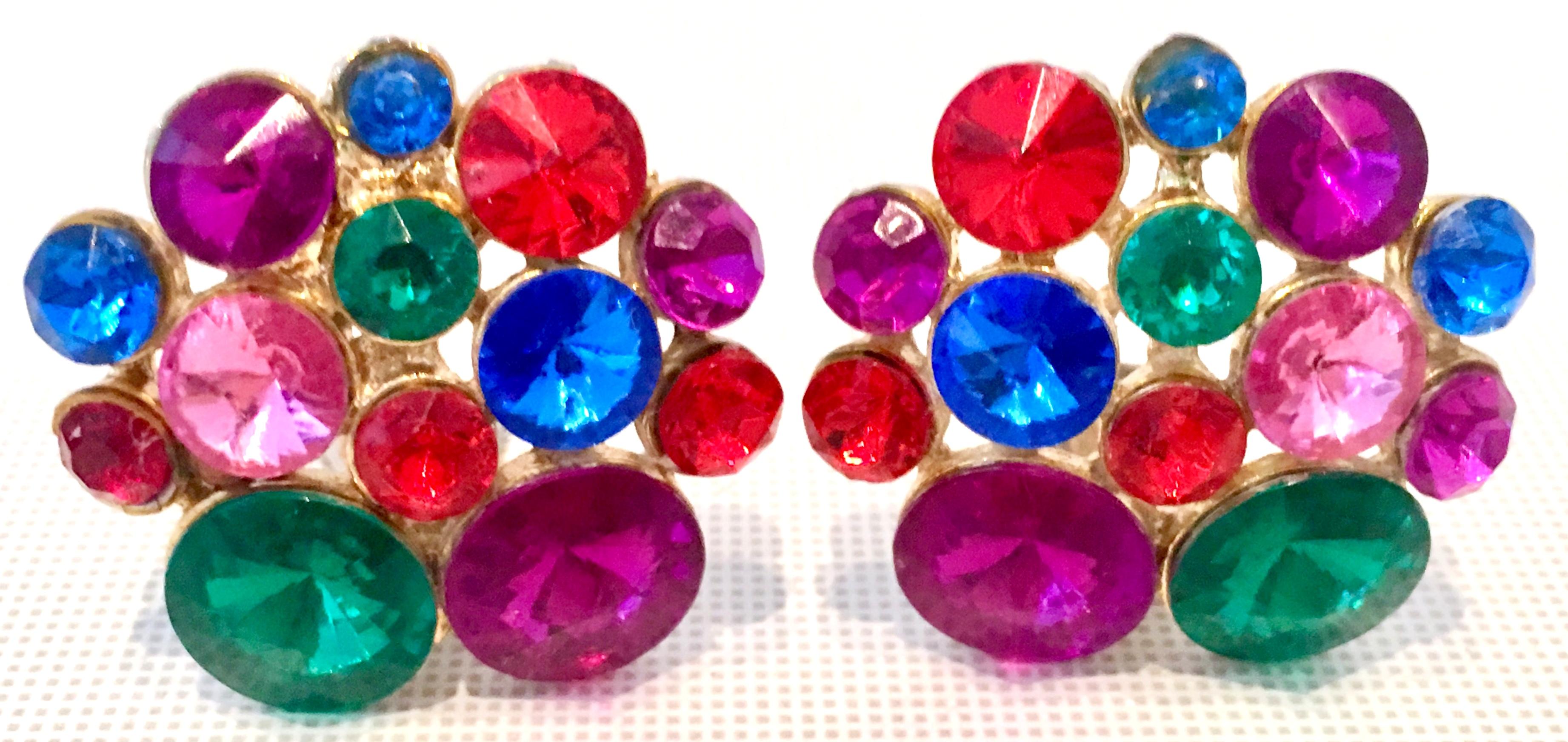 20th Century Pair Of Gold Plate & Austrian Crystal Organic Form Earrings. These clip style earrings feature, Rivoli cut and faceted multi color. These festive and dimensional earrings are clip style.
