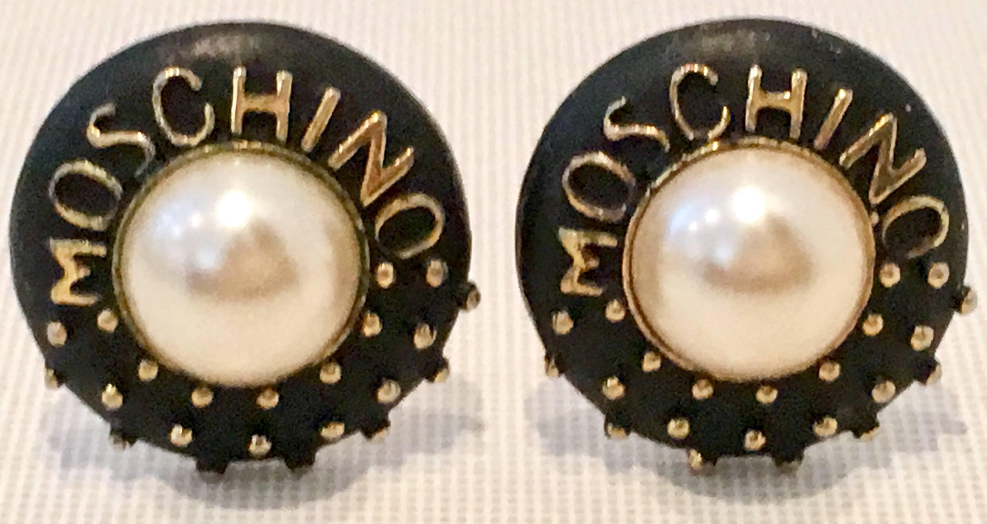 Rare 90'S Gold Plate Faux Pearl & Black Enamel Stud Moschino Logo Clip On Earrings. Central faux pearl is approximately .50