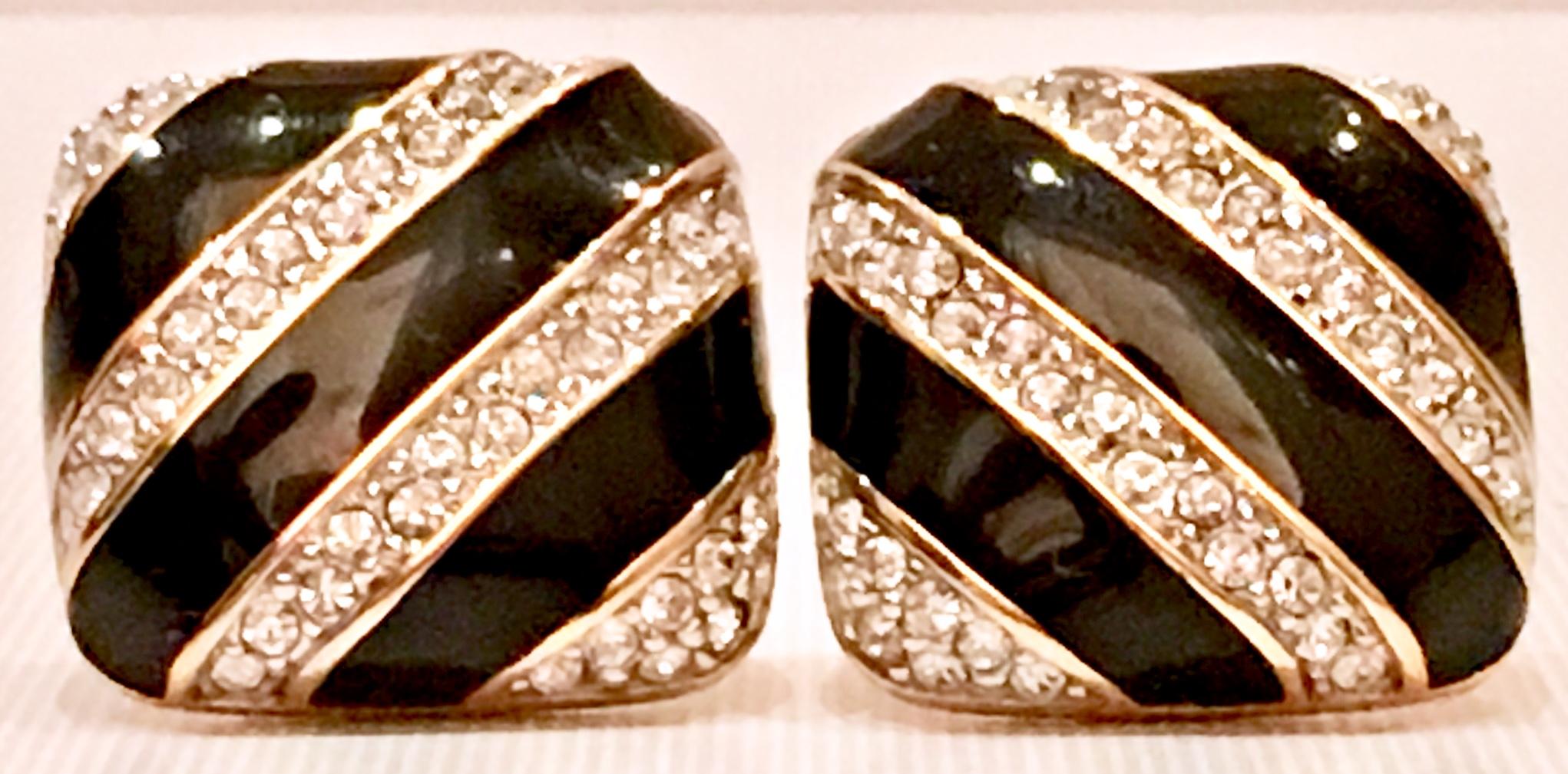 20th Century Cubist Style Gold Plate & Swarovski Crystal Clear Pave Rhinestone And Black Enamel Clip Style Earrings. These square with rounded edge earrings have the Swarovski swan trademark stamped on the underside of each piece.