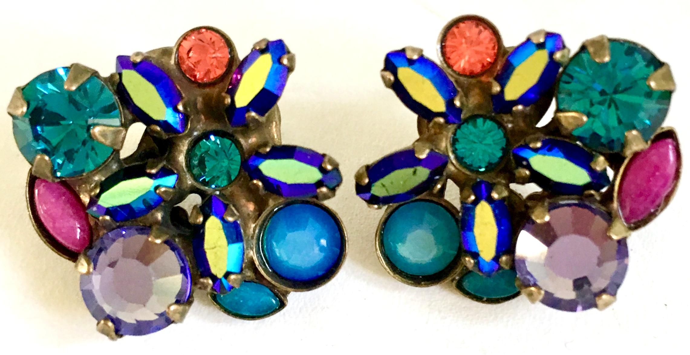 21st Century Gold & Swarovski crystal stud pierced Earrings By, Sorrelli. These bronze tone plate with prong set Swarovski crystal rhinestone abstract flower stud earrings are diminutive, dramatic and vibrant .
Each piece is signed on the underside,