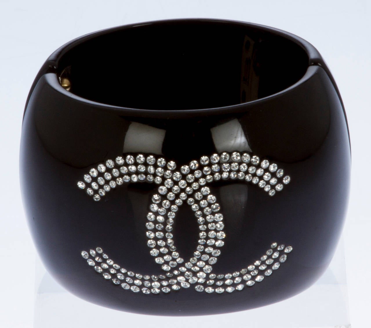 This is a striking resin cuff studded with crystals.  The interior circumference is 6.5