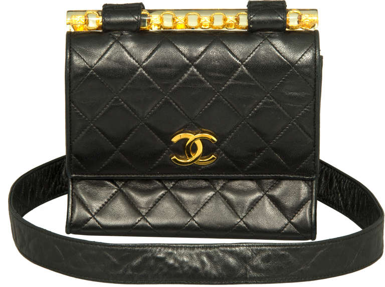 Unique looking Chanel bag with an amazing accent of a Lucite bar with gilt chain embedded within, It is comfortable to wear with a 36