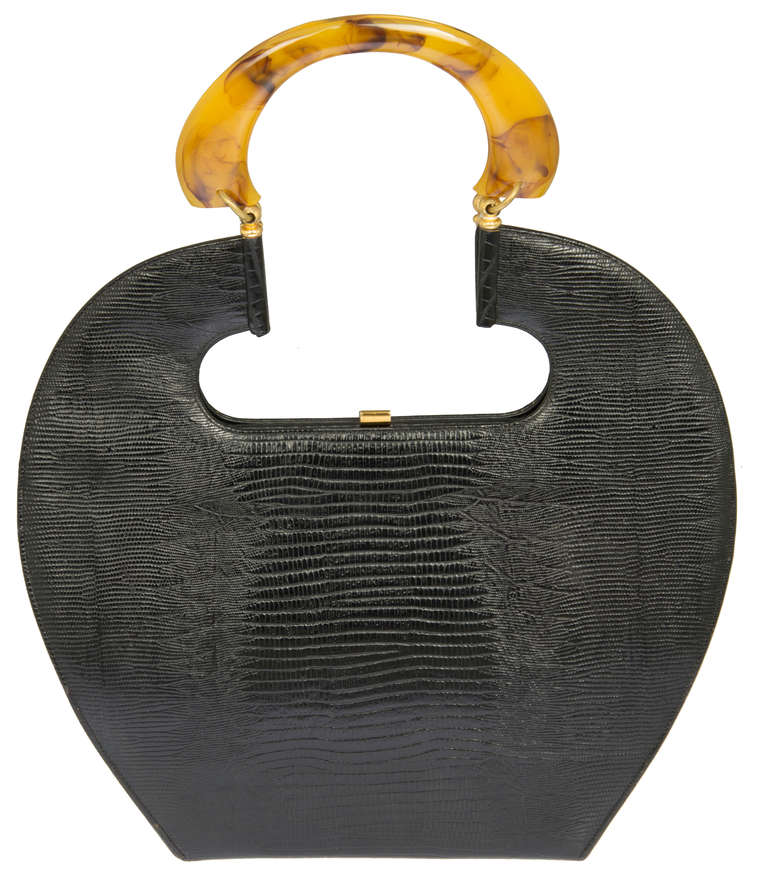 This is a fabulous handbag in excellent condition. The positive and negative space makes this a special piece.