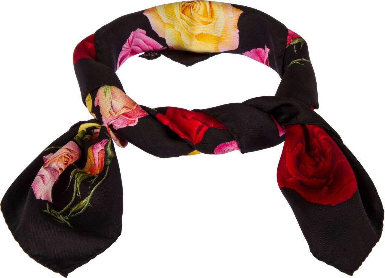 This is a beautiful scarf showing roses in different stages of development on a black background.