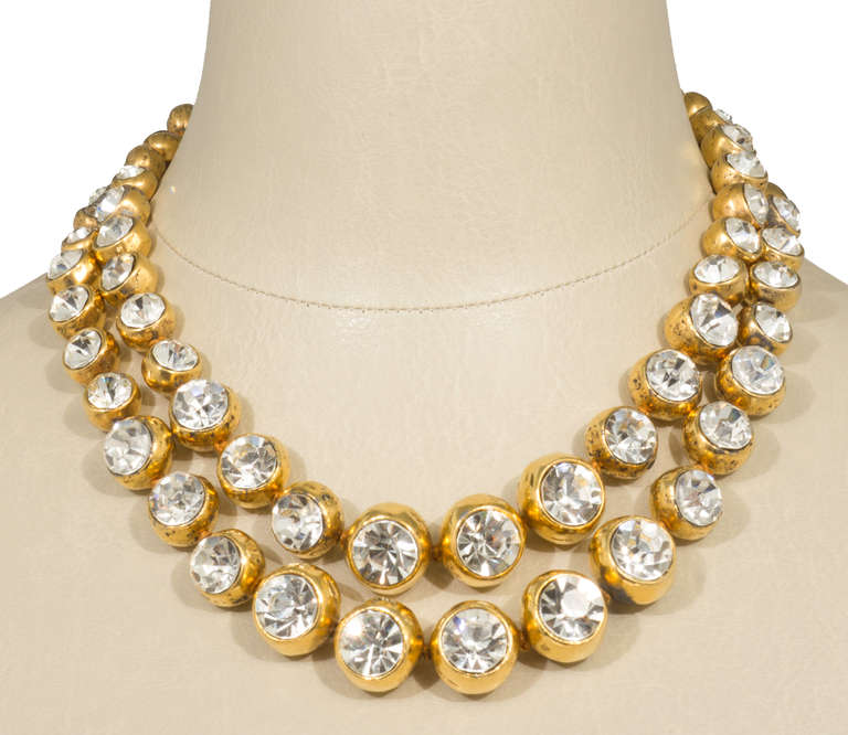 This is  a rare necklace featuring  graduated bezel set rhinestone headlights.   One could glam it up by rotating all the elements so the headlights are facing outward, or make it a little more low key by letting the elements fall as they may. The