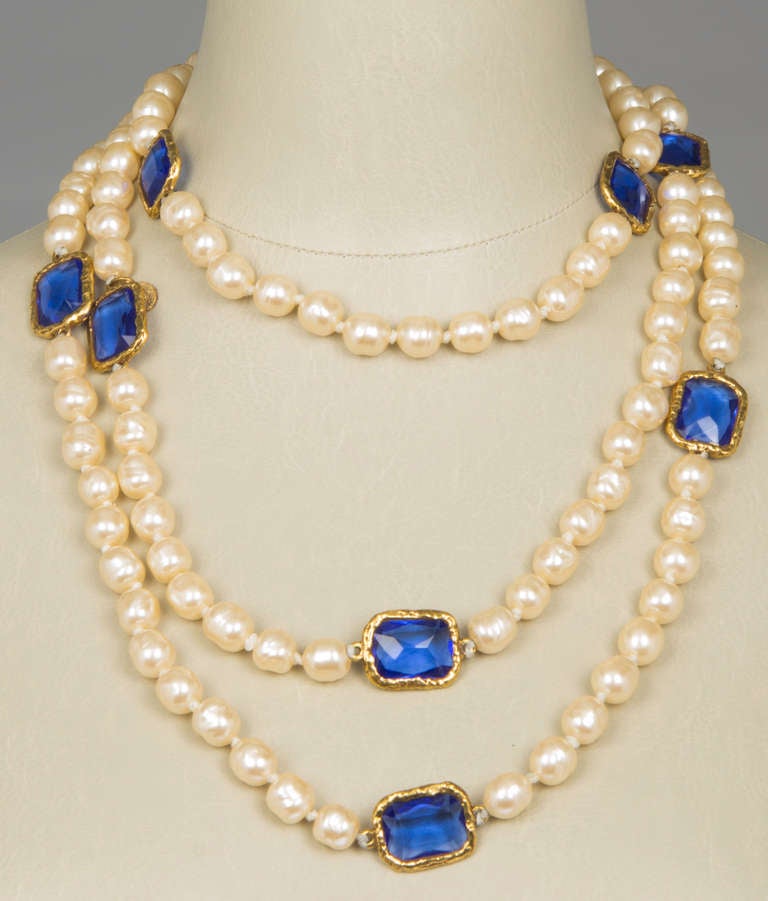 This CHANEL faux pearl necklace is highlighted by chicklets of blue.