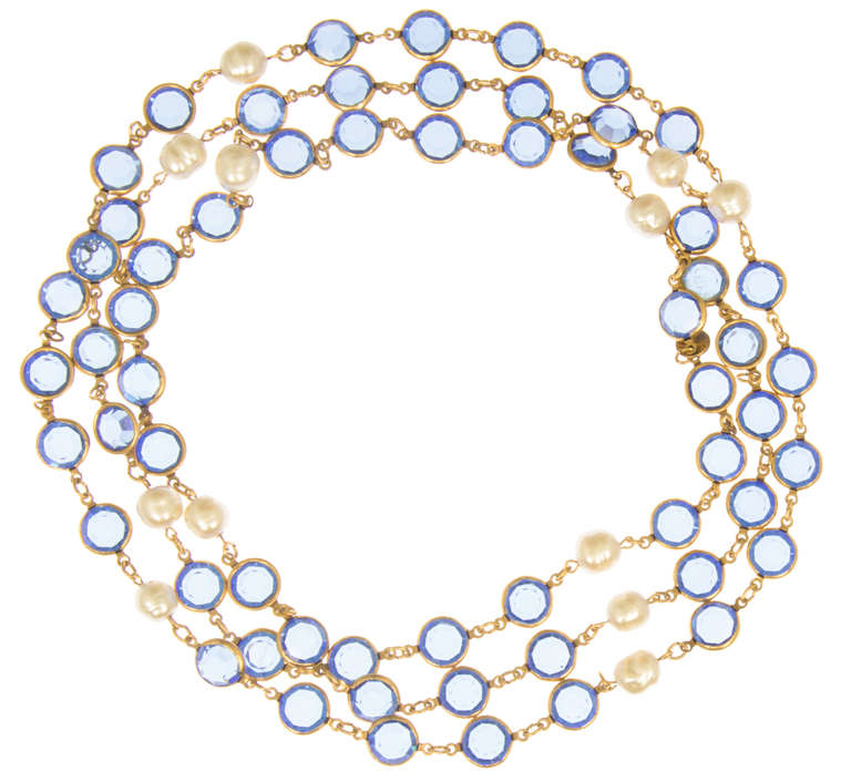 This is a very pretty necklace, a lovely blue color works so well with pearls.