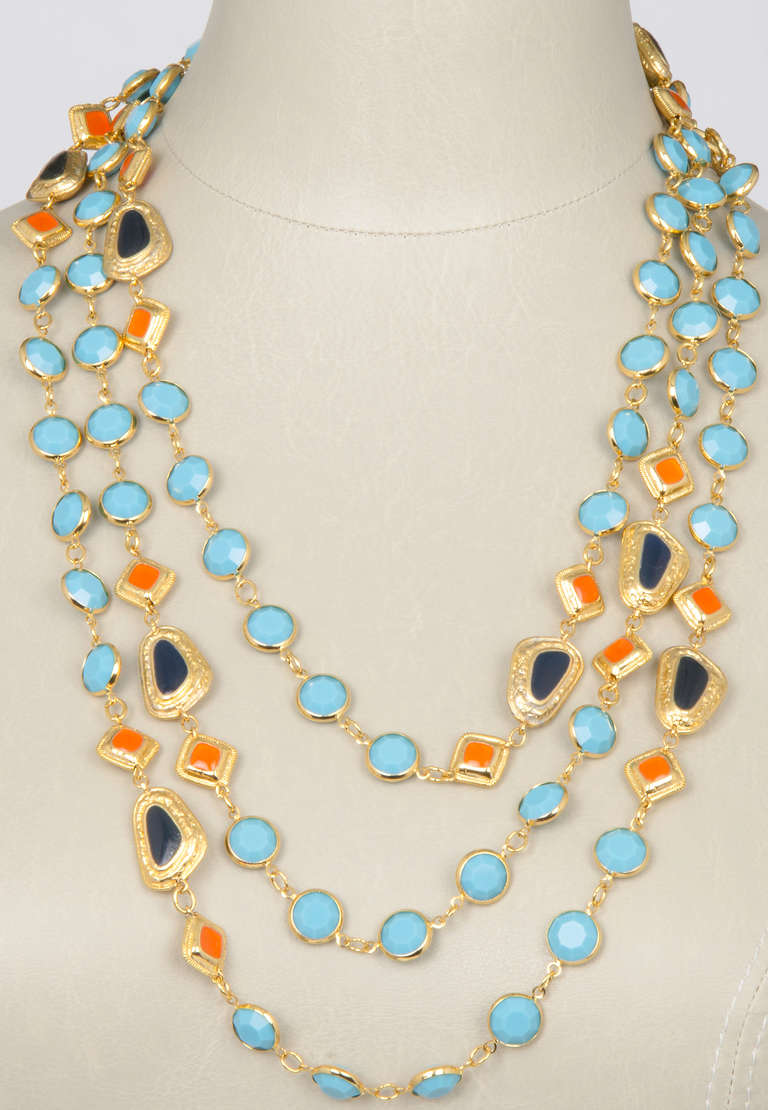 This is a great necklace with summer colors of turquoise and orange, accented with black. The long length makes this piece very versatile.