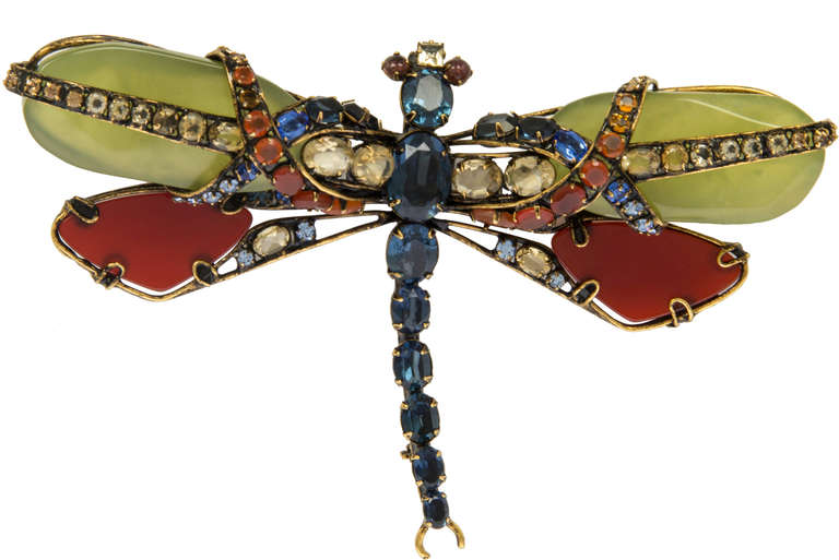 This is a beautiful brooch with multi glass jewles.