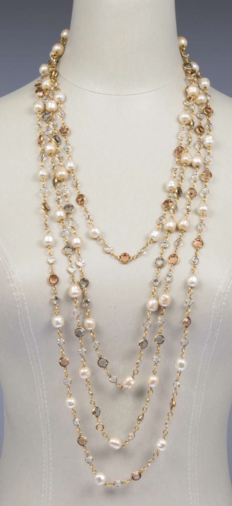 These are great looking necklaces! Light and airy they look very good worn singly and even better worn together!   One  necklace (grey rhinestones) is 69" long, as the other (clear rhinestones) is 64" long.
