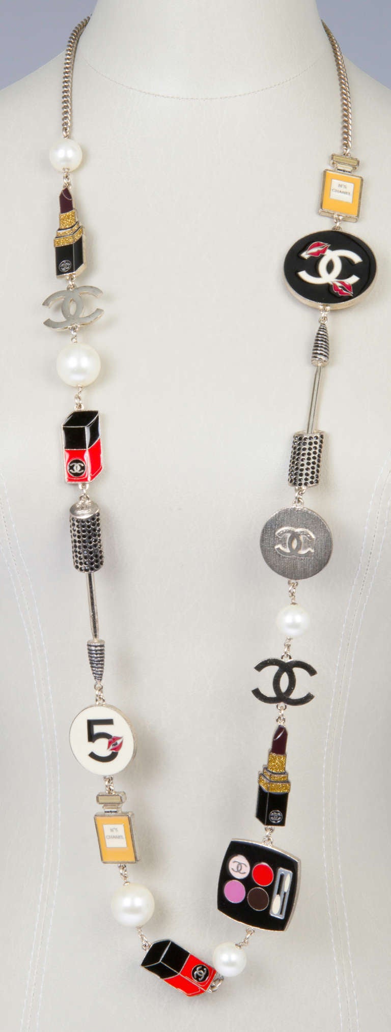 This is a fun and iconic necklace featuring many of the makeup CHANEL charms that CHANEL is known for. The necklace has an additional  2.50 inch extension and the necklace can be worn at different lengths.