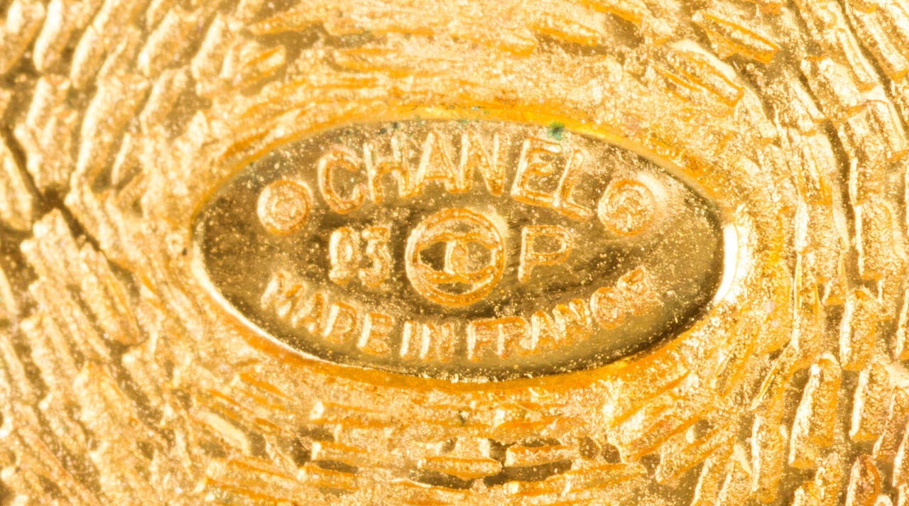 From the spring 1993 collection, these are very wearable earrings. Gold tone Chanel CC logos create a filigree over the silver tone base.