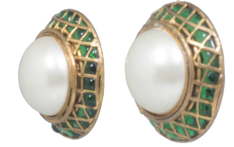 These are fabulous and sophisticated earrings. We love the treatment of the poured green glass in a geometric pattern.