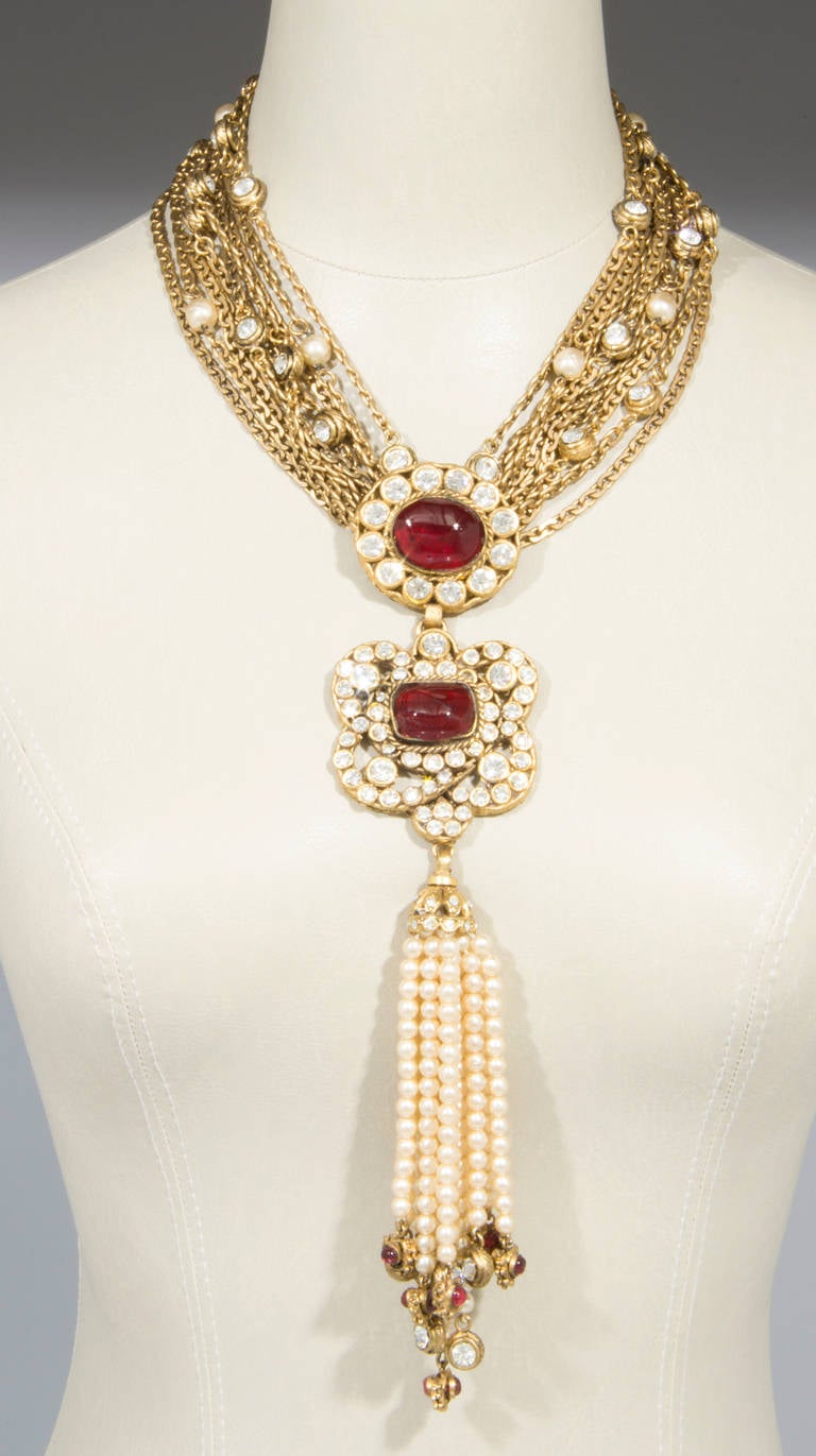 This is an exquisite rare necklace. Originally purchased in Paris in 1984 as one of two made, it is now one of the rarest and most stunning necklaces by CHANEL. Such a beautiful combination of pearls, crystals and gripoix glass!

The pendant drop