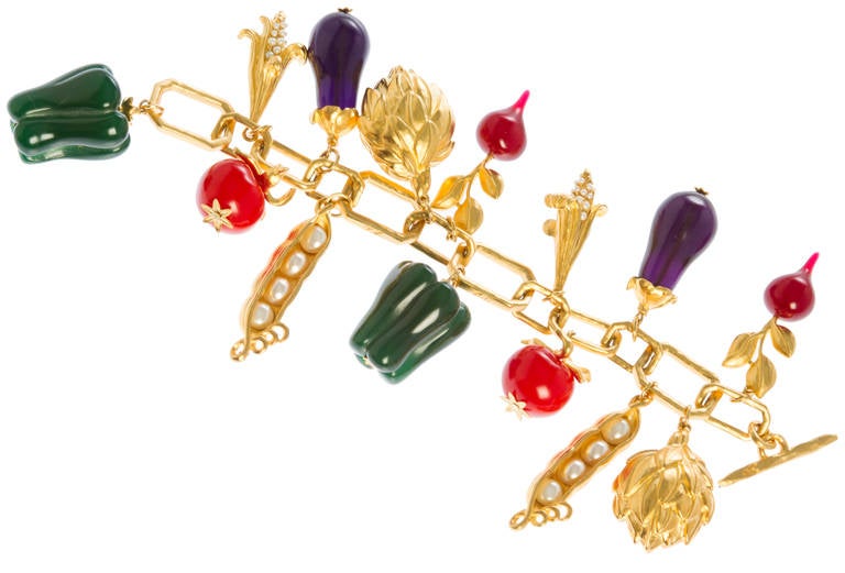 This is a fun and rare bracelet by Karl Lagerfeld adorned with resin peppers, eggplant, radishes, turnips and tomatoes and faux pear corn kernels and peas.